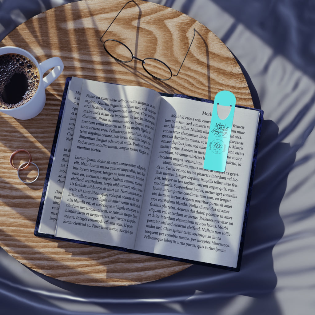 Elegant aluminum bookmark featuring a laurel wreath LGA monogram and “Love People Anyway” message with brushed metal backing and secure page-holding slot for books, journals, and devotionals.