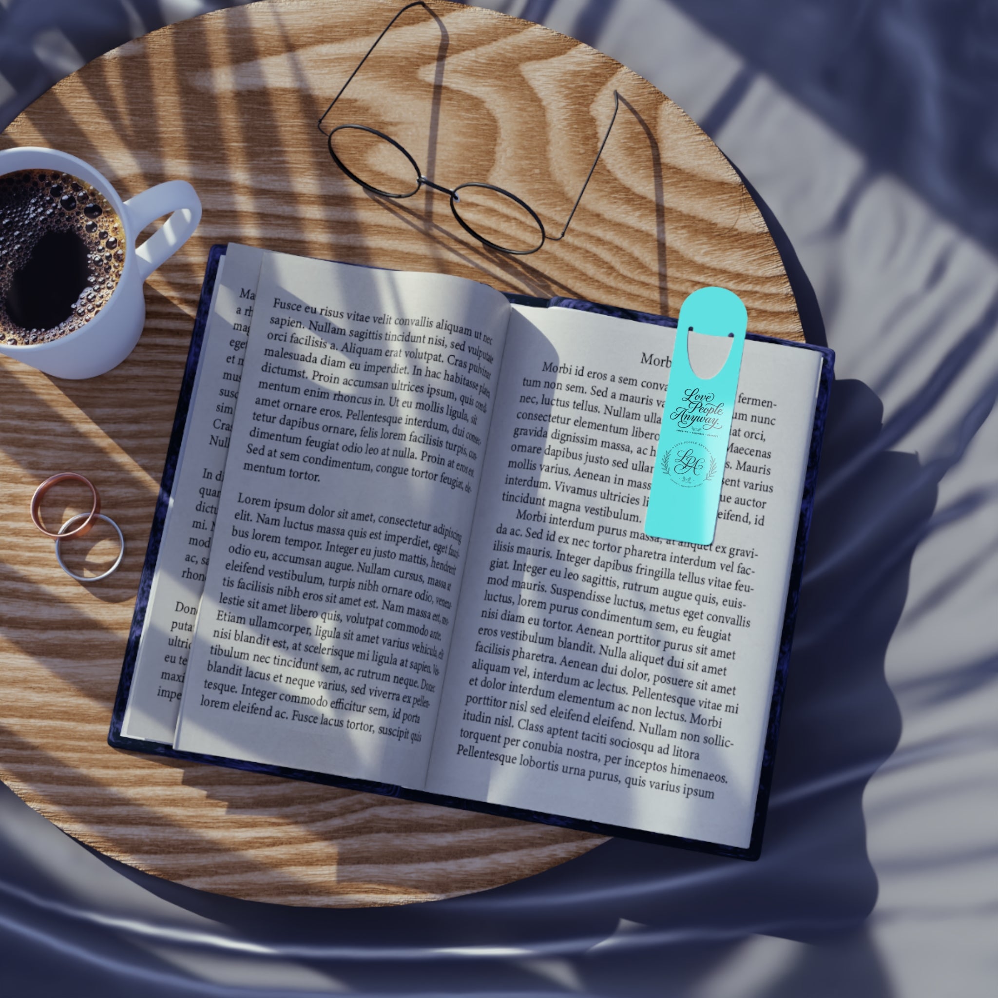 Elegant aluminum bookmark featuring a laurel wreath LGA monogram and “Love People Anyway” message with brushed metal backing and secure page-holding slot for books, journals, and devotionals.