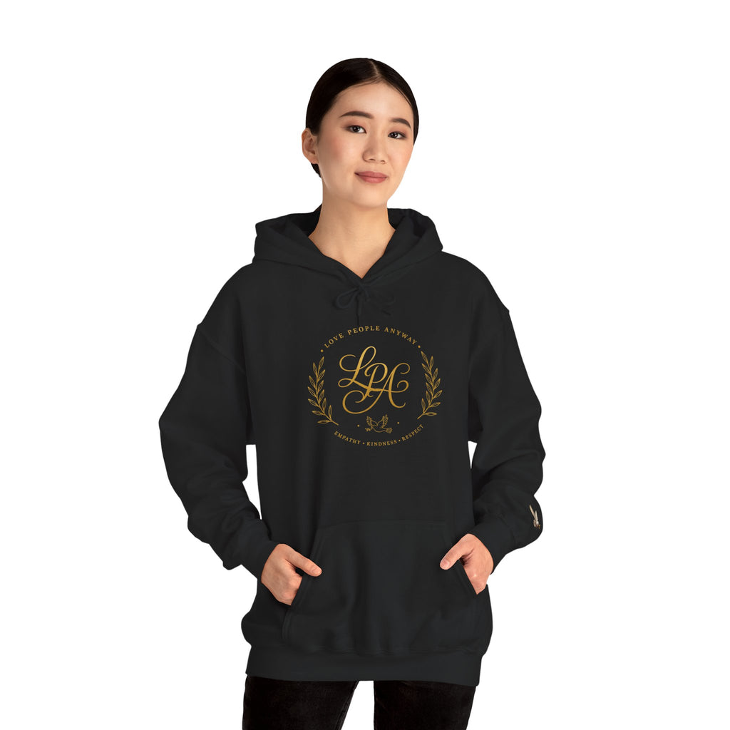 Inspirational Christian hoodie featuring elegant “Love People Anyway” script typography on a soft, cozy hooded sweatshirt designed to encourage kindness and compassion.