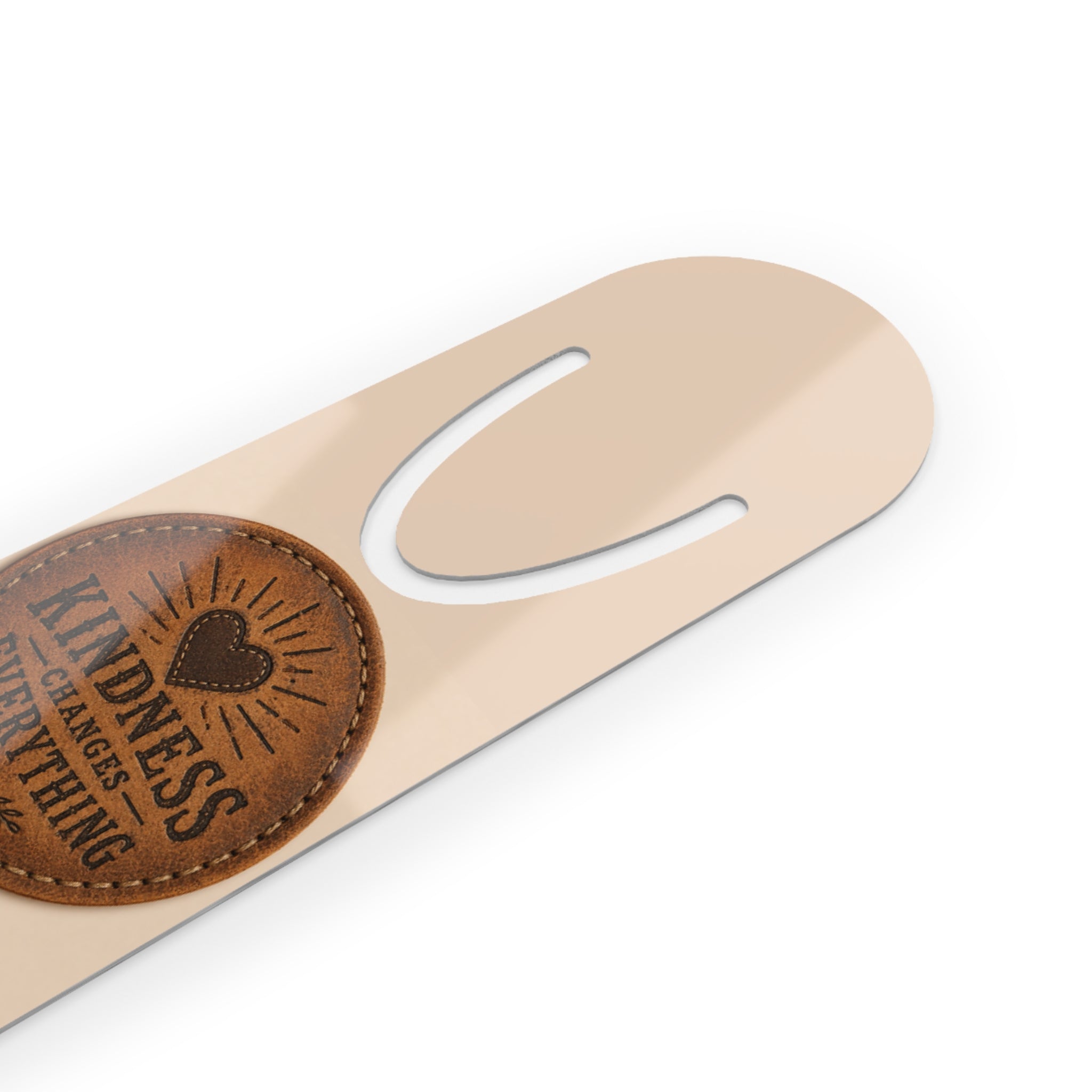 Personalized aluminum bookmark featuring a leather token design and the phrase “Kindness Changes Everything,” with custom name option, brushed metal backing, and secure page-holding slot.