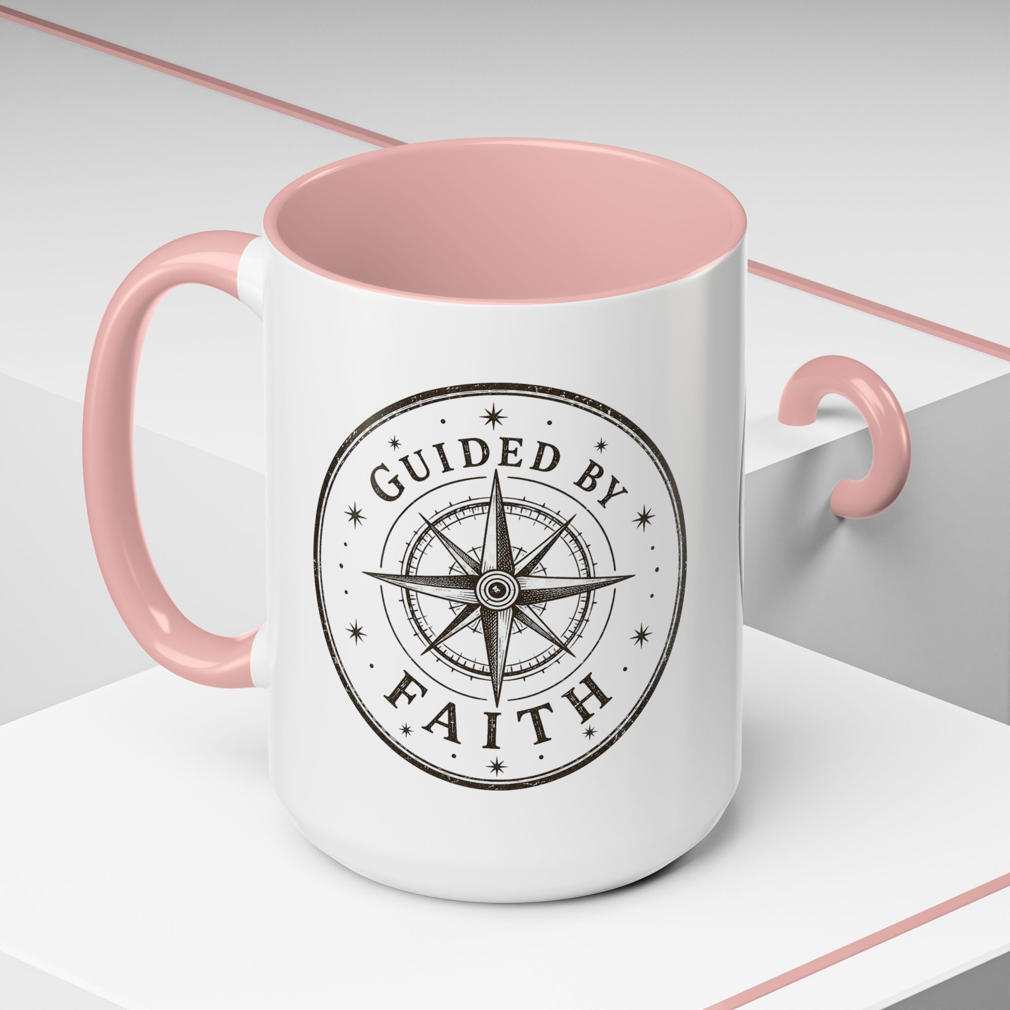 Inspirational ceramic accent coffee mug featuring a compass design and “Guided by Faith” message with colorful handle and interior accents on a glossy white mug.