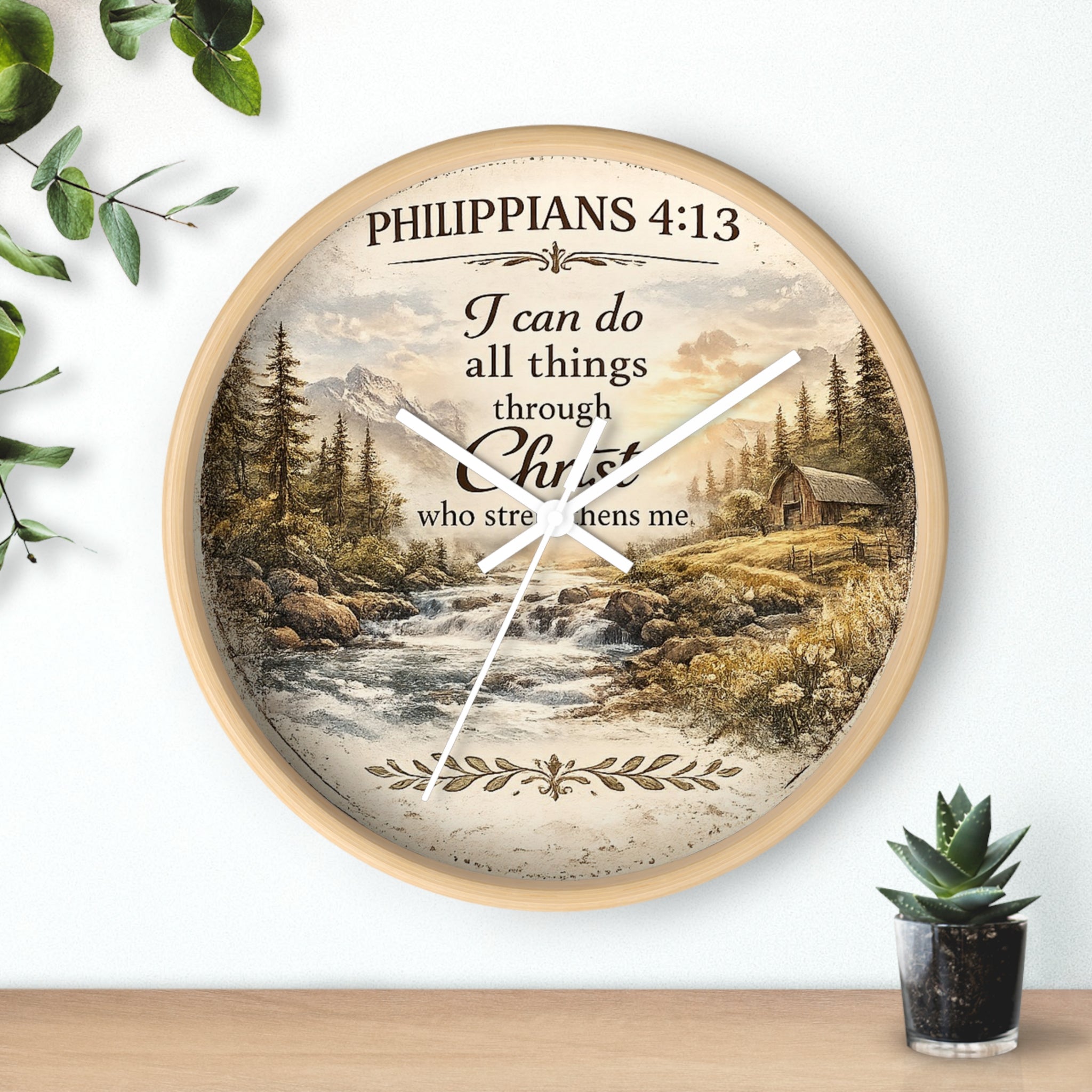 Inspirational Christian wall clock featuring Philippians 4:13 with a rustic cabin, flowing river, pine trees, and peaceful countryside landscape in warm vintage tones.