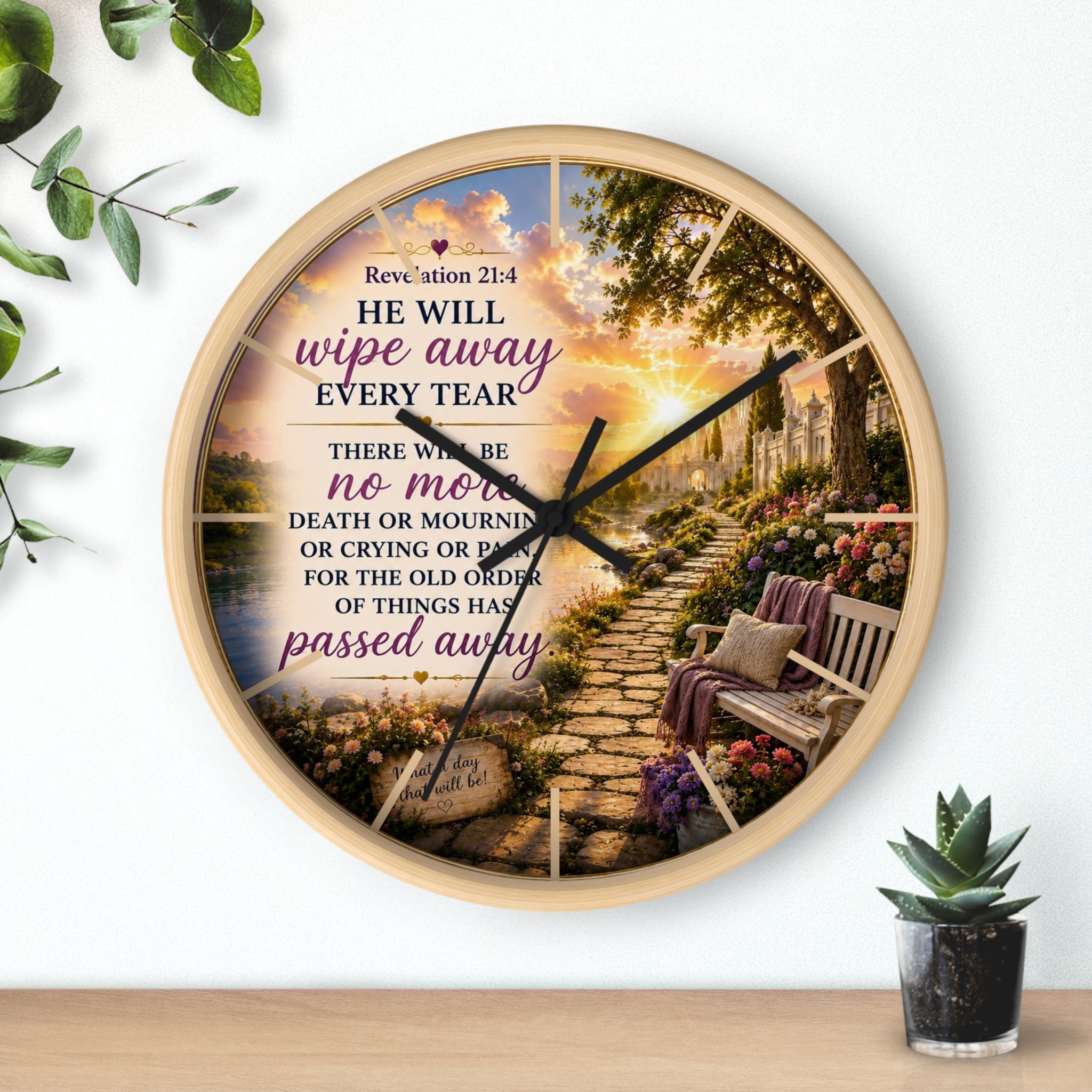 Inspirational Christian wall clock featuring a peaceful lakeside garden path, floral scenery, and Revelation 21:4 scripture in warm comforting tones.