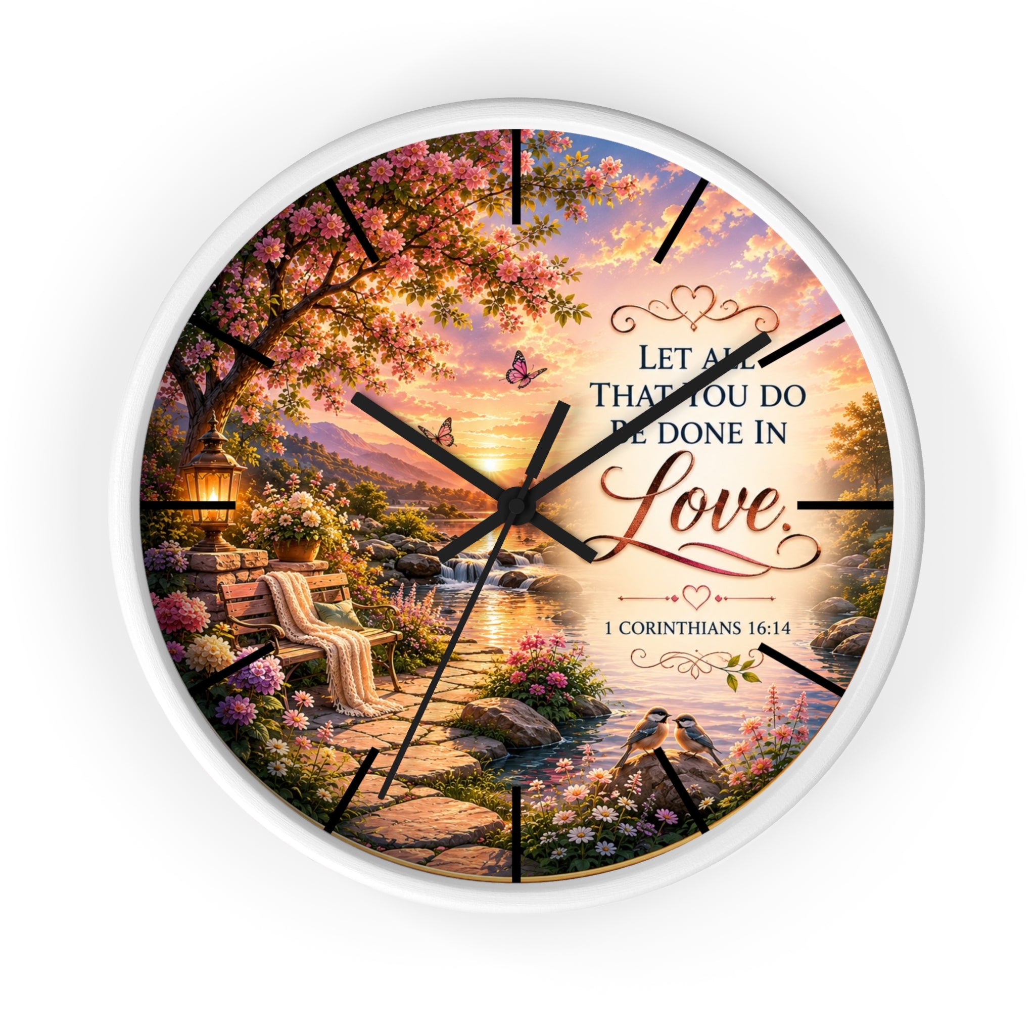 Inspirational Christian wall clock featuring a flower-lined lakeside sunrise scene with 1 Corinthians 16:14 scripture about doing all things in love.