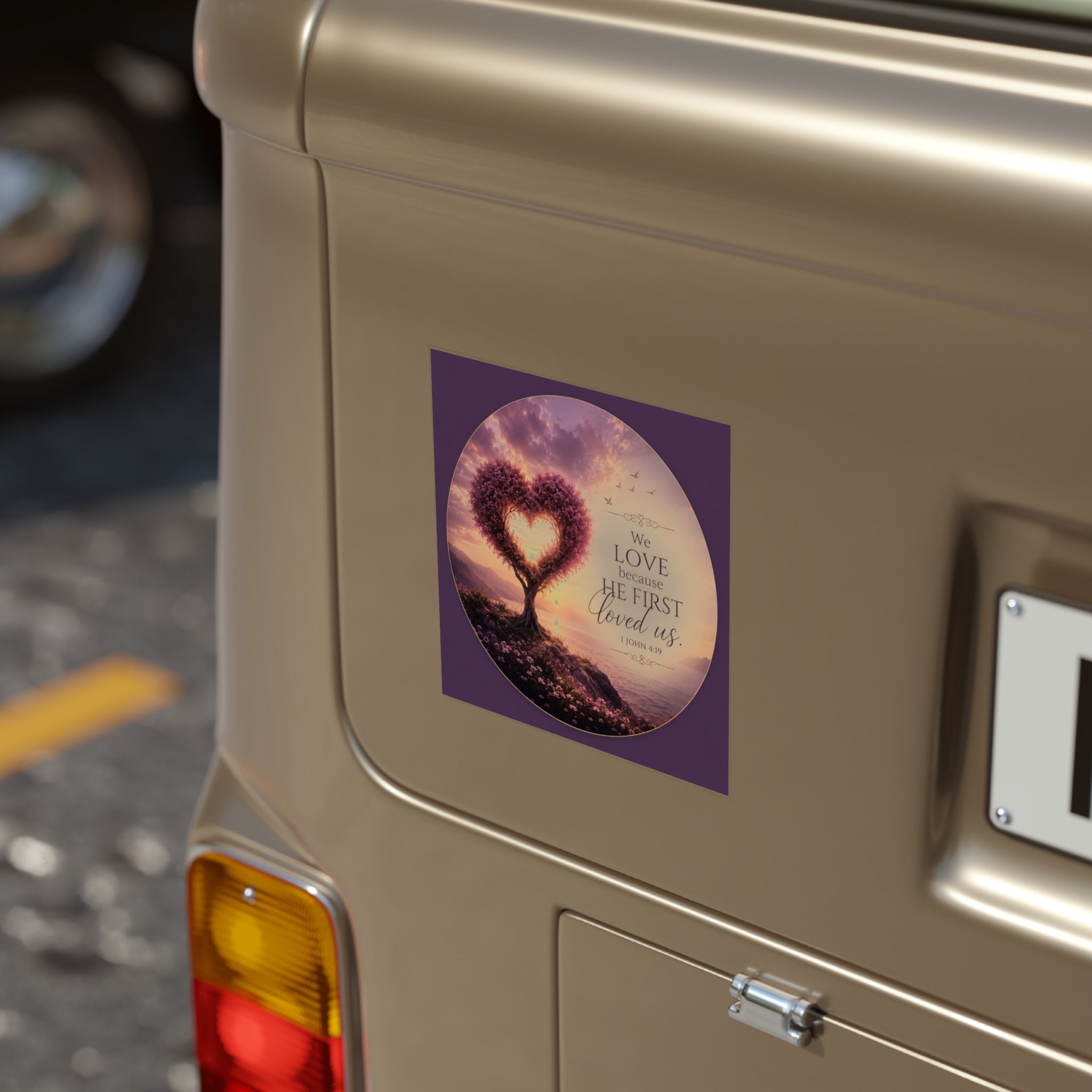 Car sticker with heart design and text on a vehicle's rear door.