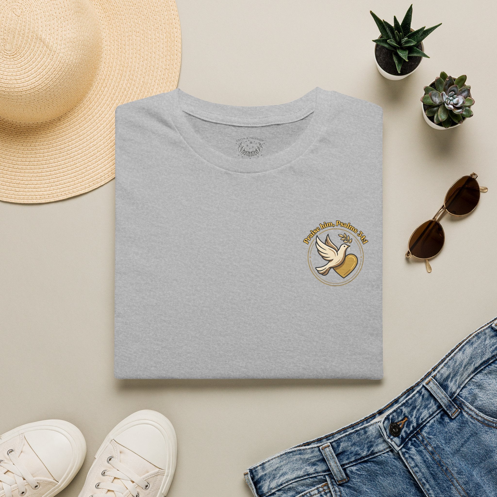 Minimalist Christian T-shirt featuring a Dove of Peace chest emblem with the words “Pray, Love, Remember” on a soft lightweight faith-inspired tee.