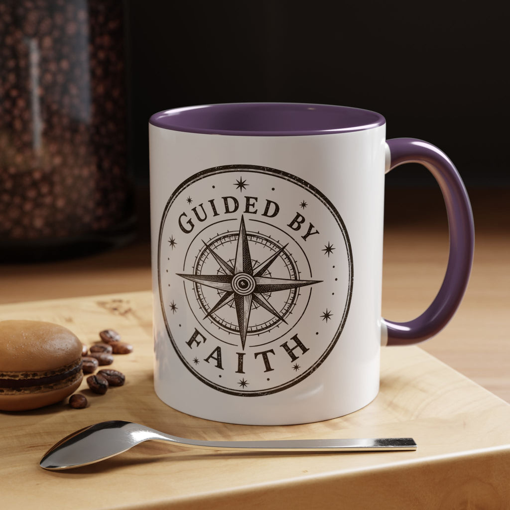 Inspirational ceramic accent coffee mug featuring a compass design and “Guided by Faith” message with colorful handle and interior accents on a glossy white mug.