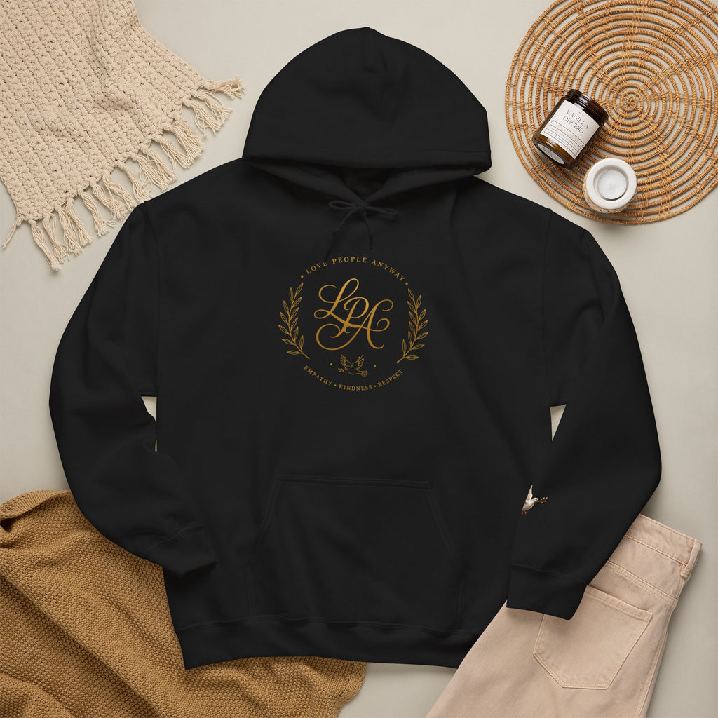 Inspirational Christian hoodie featuring elegant “Love People Anyway” script typography on a soft, cozy hooded sweatshirt designed to encourage kindness and compassion.