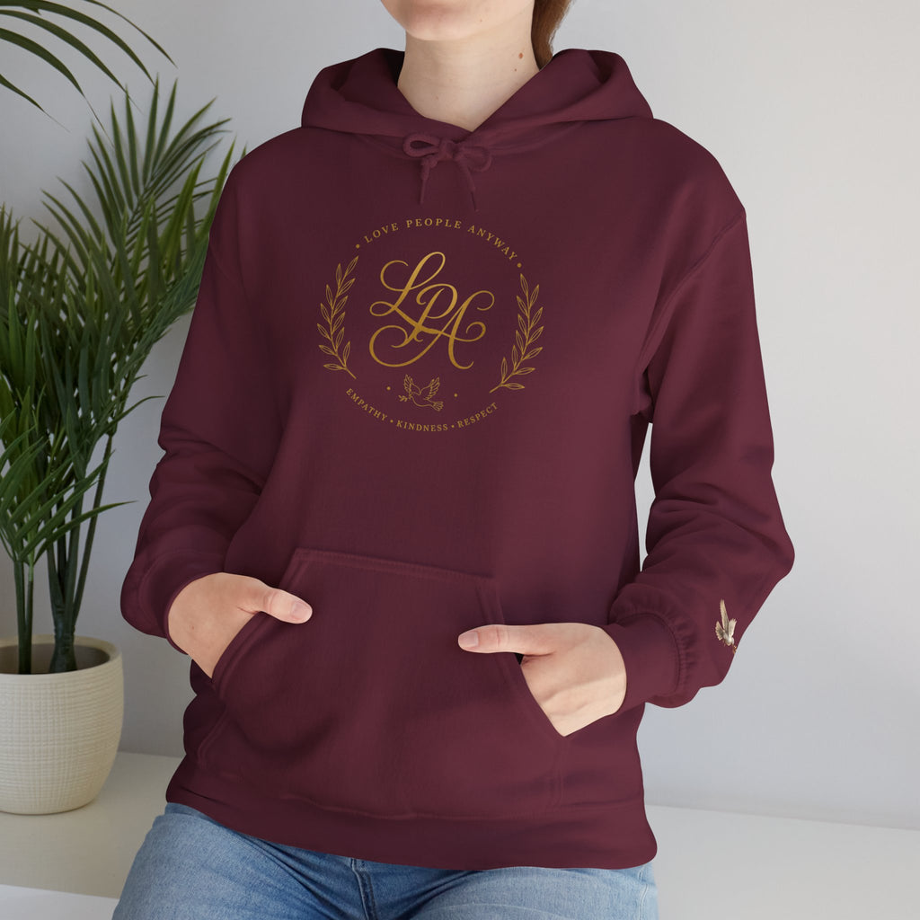 Inspirational Christian hoodie featuring elegant “Love People Anyway” script typography on a soft, cozy hooded sweatshirt designed to encourage kindness and compassion.
