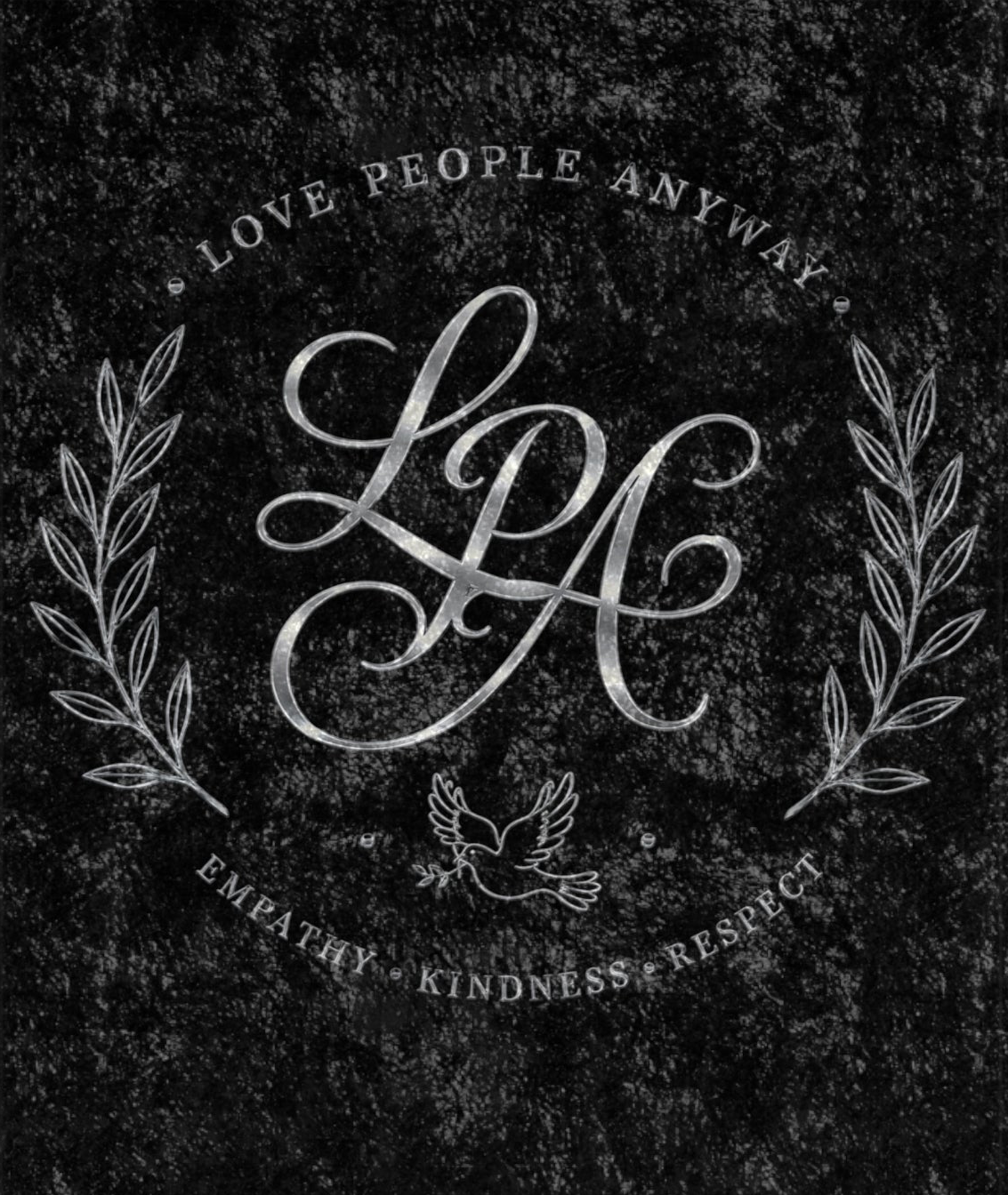Black crushed velvet blanket featuring a vintage monogram, laurel wreath, and the words "Love People Anyway" in an elegant distressed design.