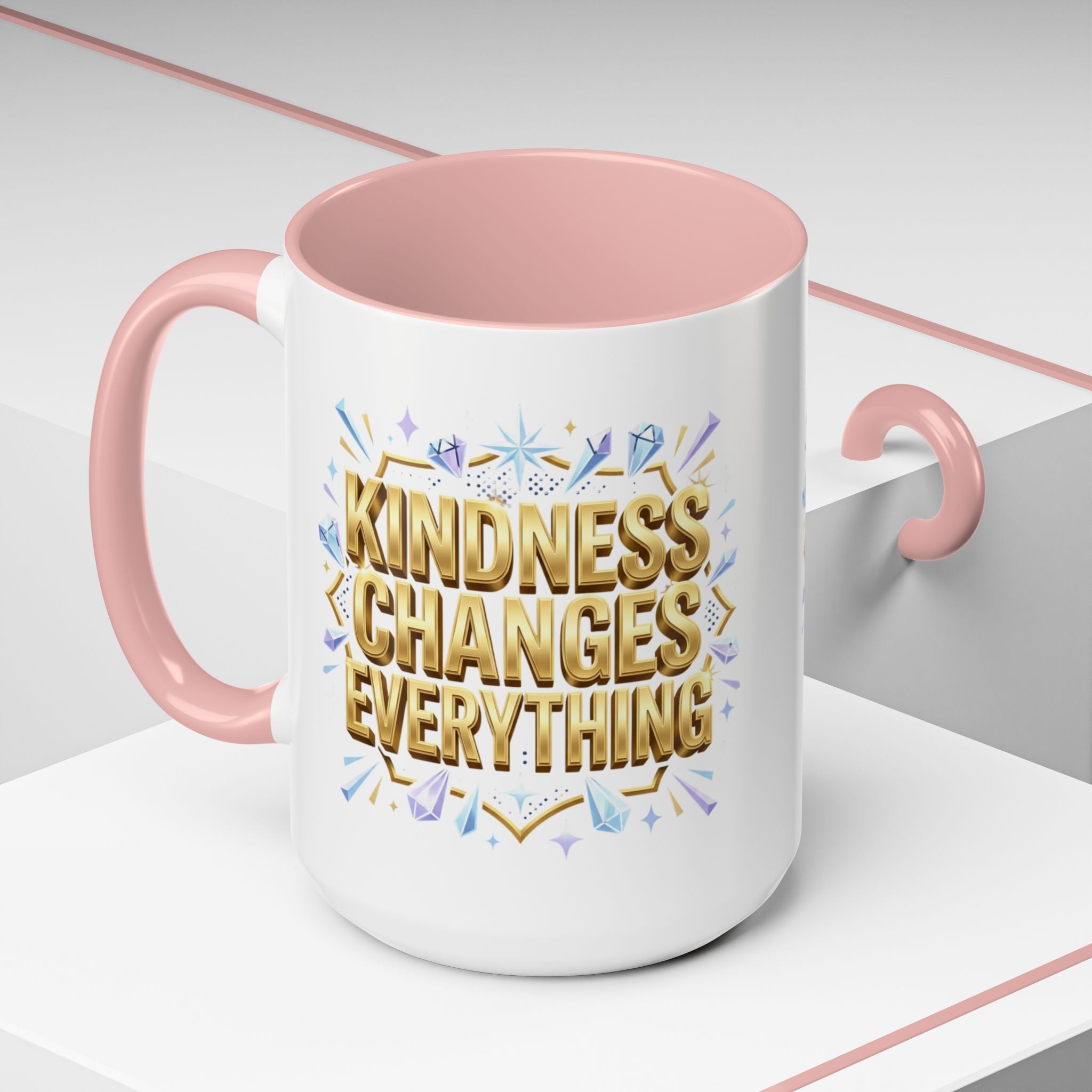 Inspirational ceramic accent coffee mug featuring “Kindness Changes Everything” in elegant gold script with sparkles and colorful accent handle and interior.