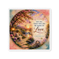 Christian die-cut magnet featuring 1 Corinthians 16:14, a colorful garden landscape with blooming flowers, butterflies, a peaceful stream, birds, and the scripture “Let All That You Do Be Done in Love” at sunset.