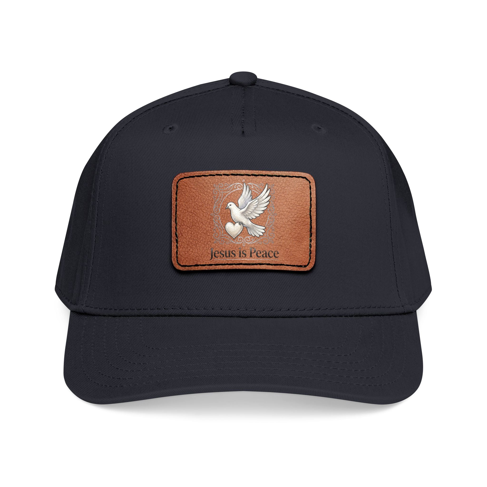 Black and tan Christian baseball cap featuring a brown leather patch with a white dove carrying a heart and the words "Jesus Is Peace."