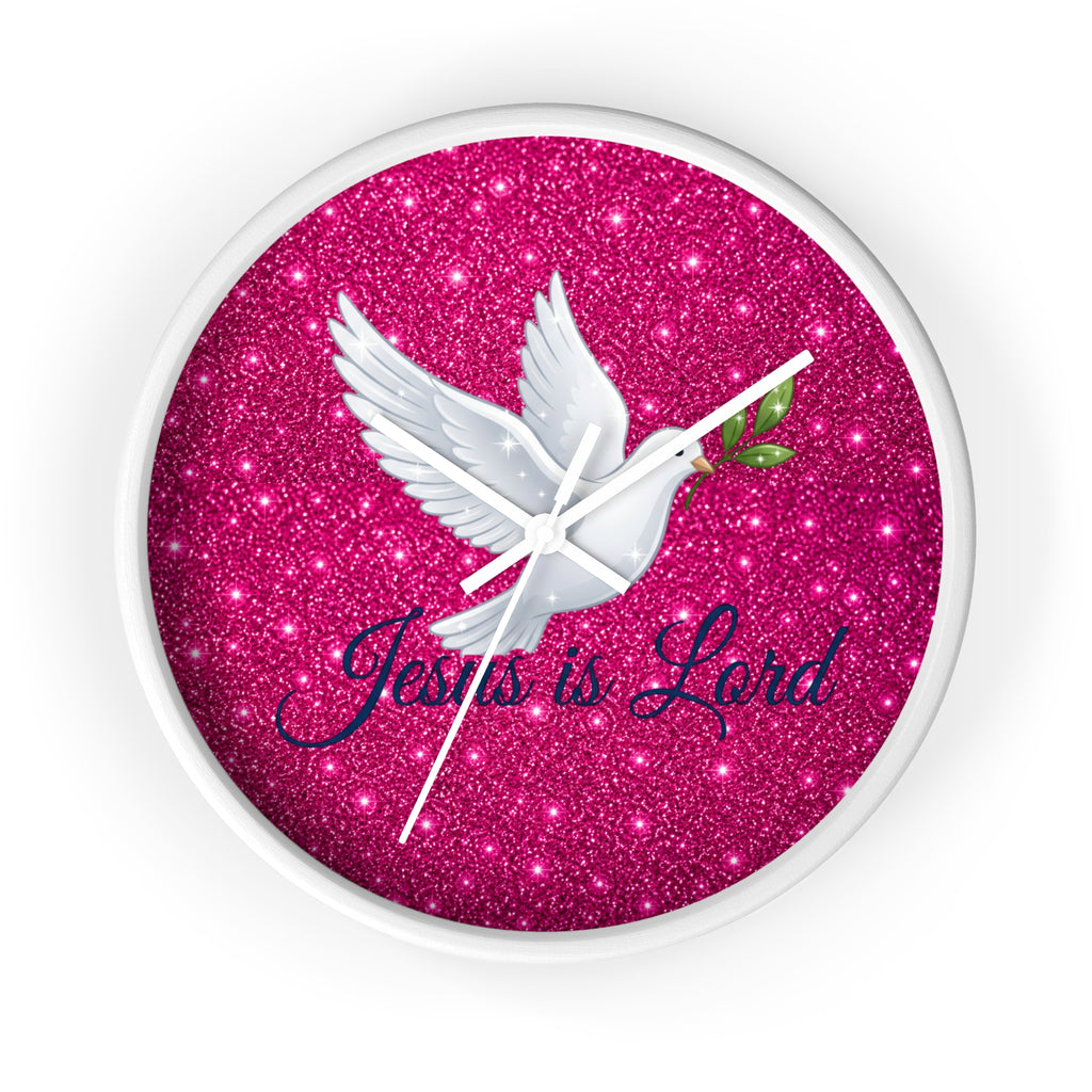 Round wall clock featuring a white dove carrying an olive branch with the words "Jesus Is Lord" on a sparkling pink background, finished with a wood frame and silent quartz movement.
