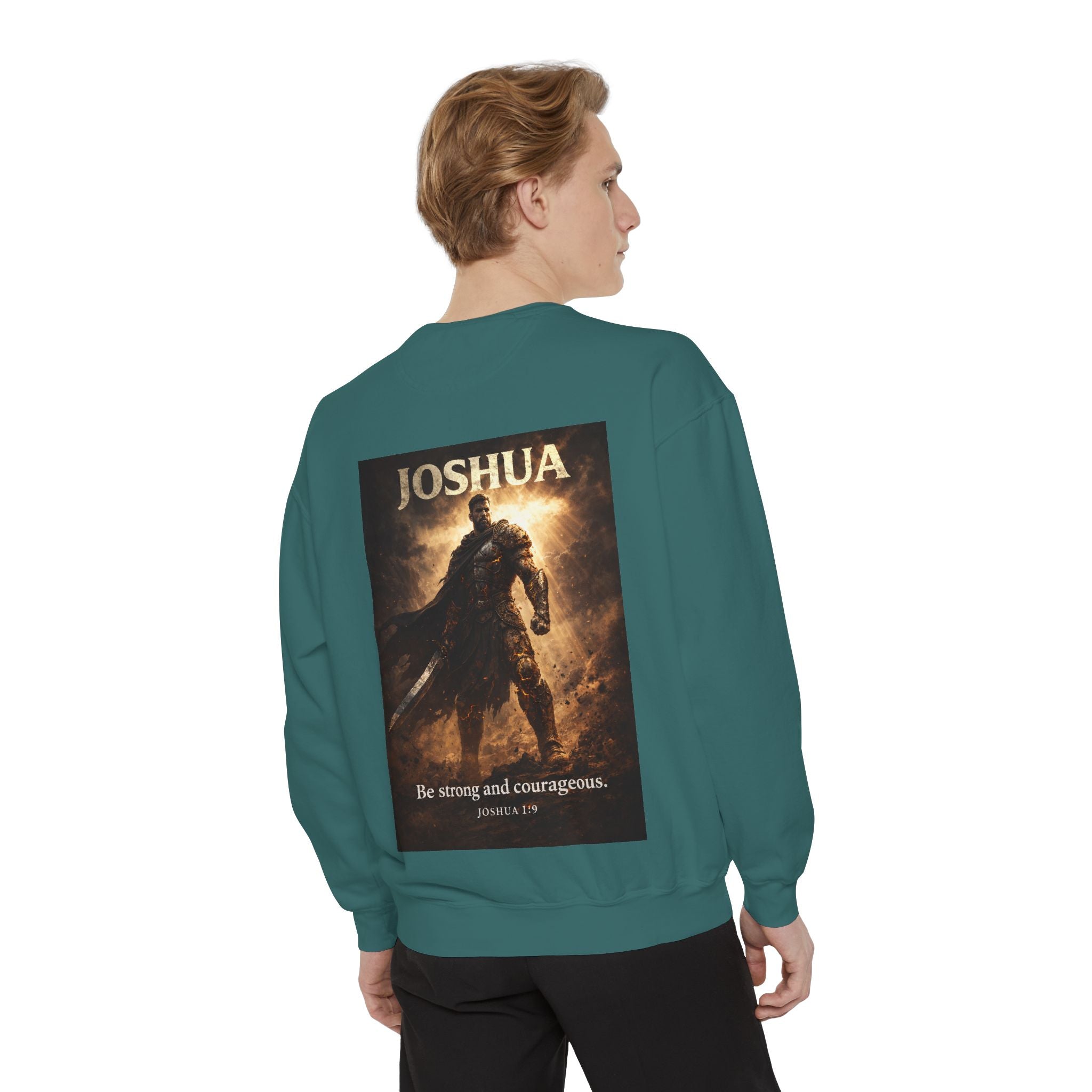 Christian crewneck sweatshirt featuring “Be Strong and Courageous” faith-inspired artwork with subtle chest embroidery and dramatic Joshua-themed back design.