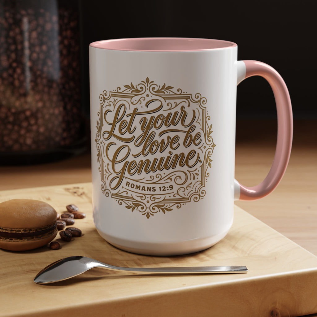 Inspirational ceramic accent coffee mug featuring Romans 12:9 and the message “Let Your Love Be Genuine” in elegant gold script with decorative flourishes and black accent handle and interior.