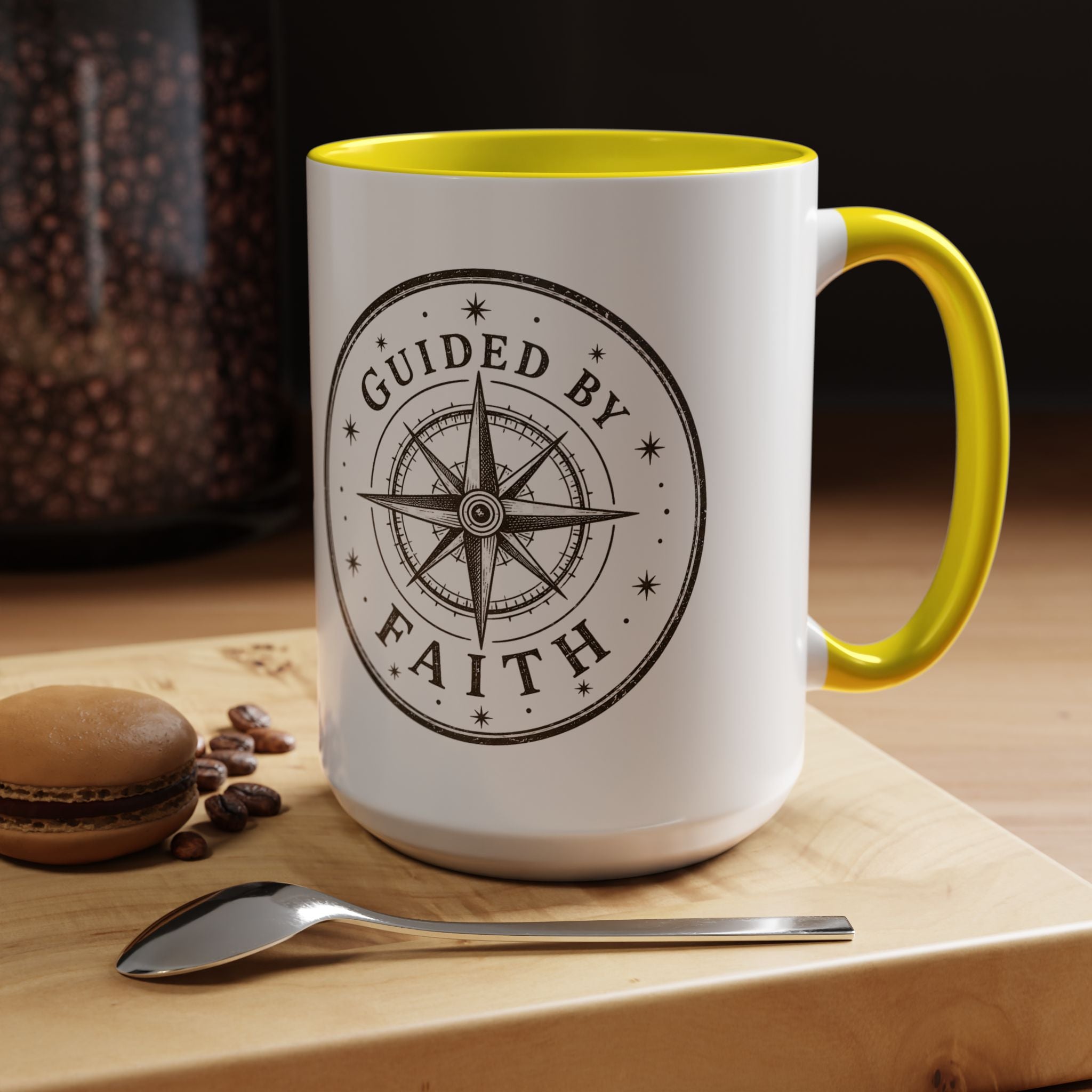 Inspirational ceramic accent coffee mug featuring a compass design and “Guided by Faith” message with colorful handle and interior accents on a glossy white mug.