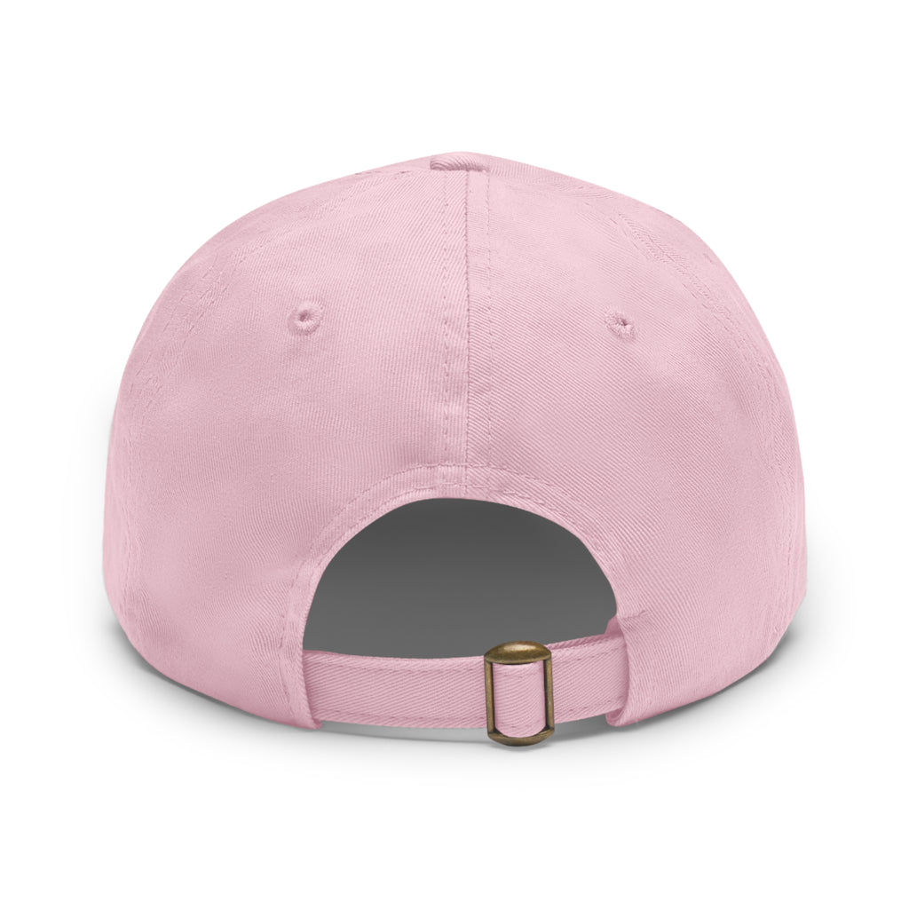Back view of a light pink cotton dad hat showing the adjustable self-fabric strap with an antique brass tri-glide buckle and unstructured six-panel construction.