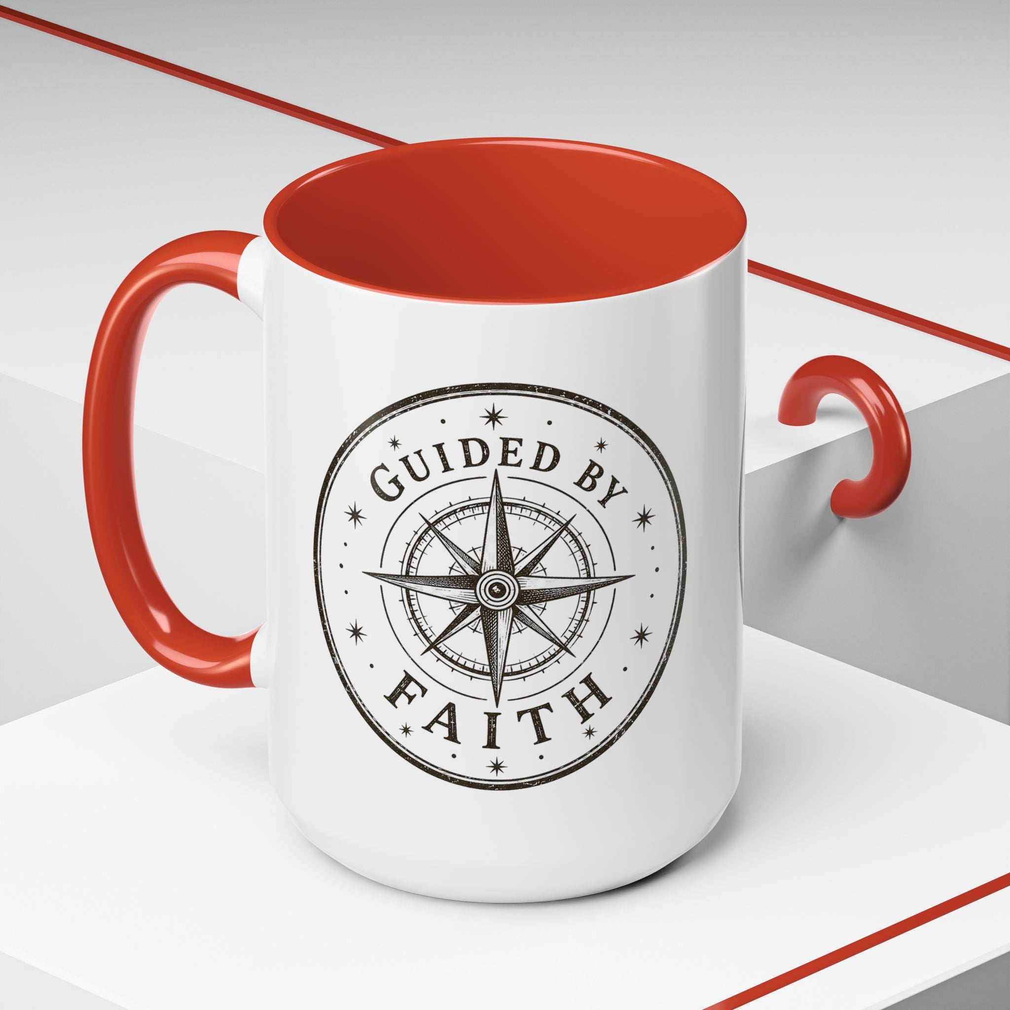 Inspirational ceramic accent coffee mug featuring a compass design and “Guided by Faith” message with colorful handle and interior accents on a glossy white mug.