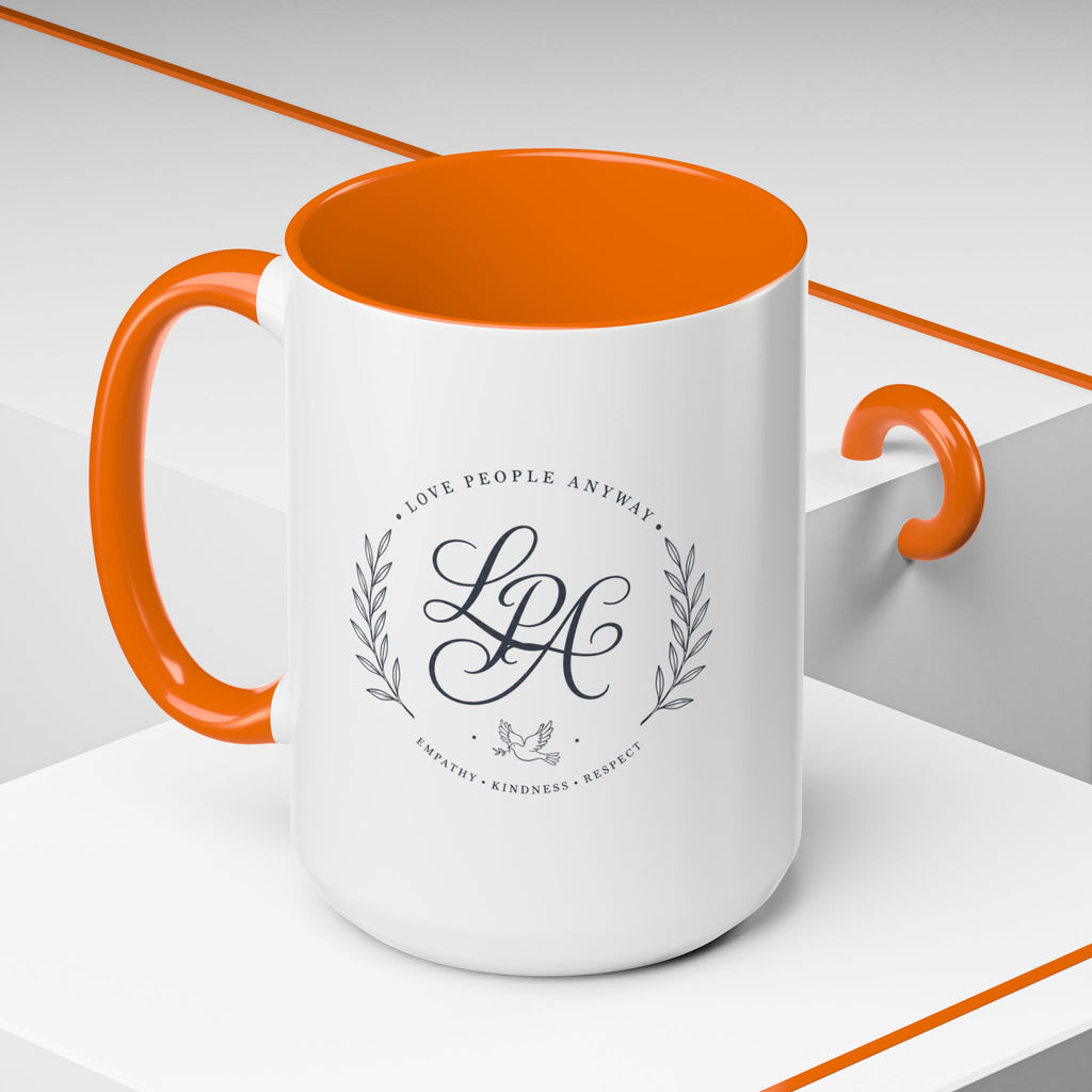Personalized ceramic accent coffee mug featuring a custom monogram crest and the inspirational message “Love People Anyway” with colorful handle and interior accents.