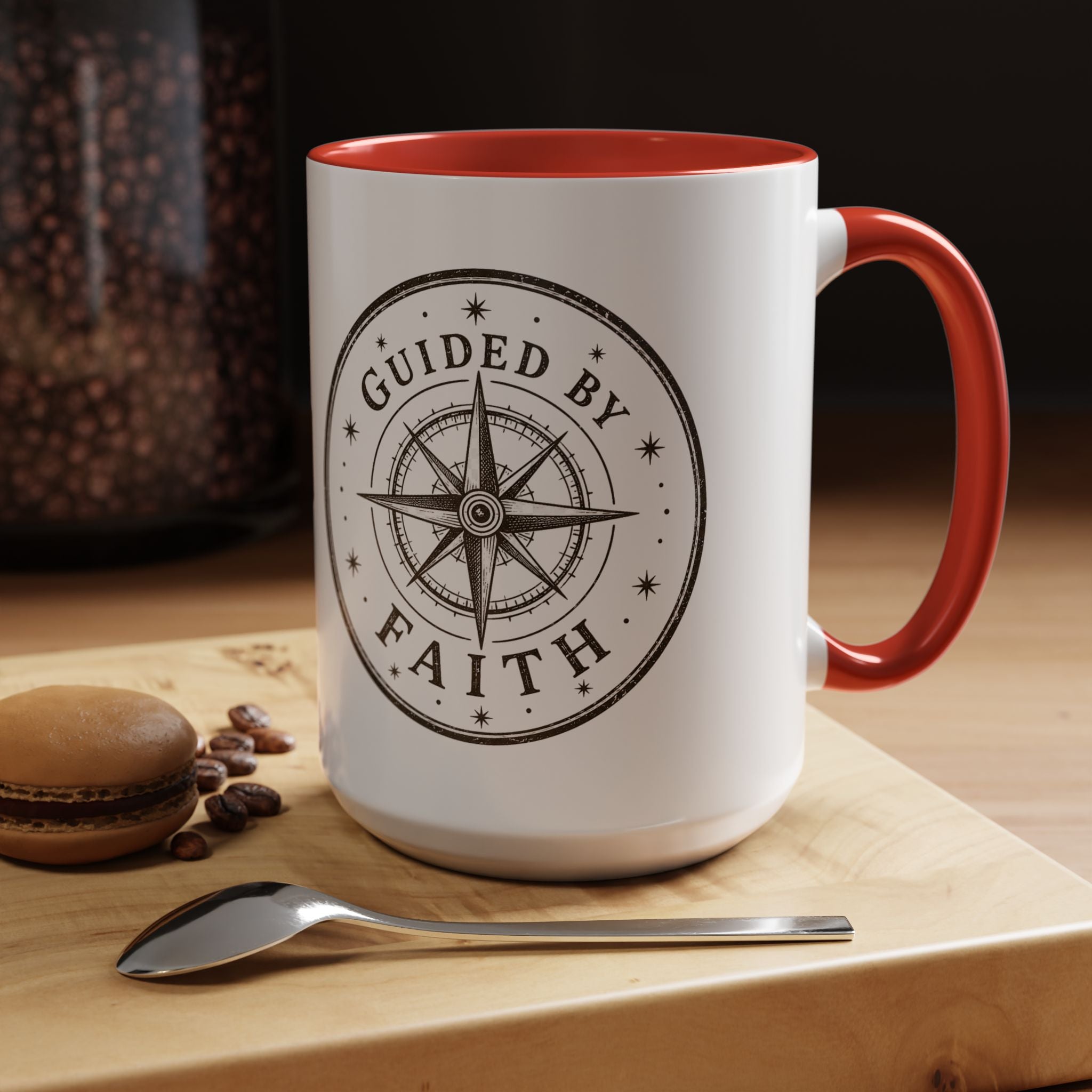 Inspirational ceramic accent coffee mug featuring a compass design and “Guided by Faith” message with colorful handle and interior accents on a glossy white mug.