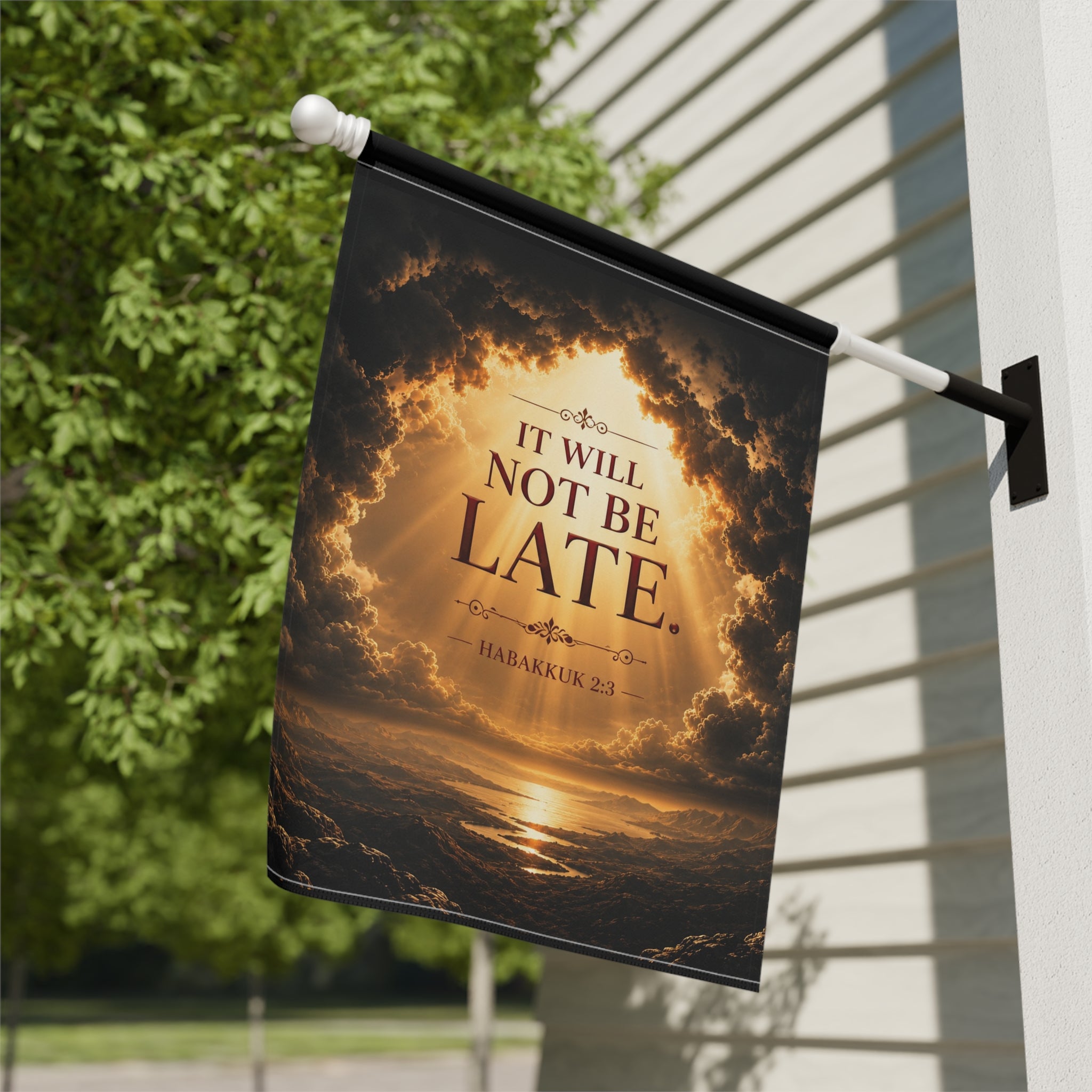 Inspirational garden flag featuring a peaceful sunrise scene with the words “It Will Not Be Late” inspired by Habakkuk 2:3 in warm golden tones.