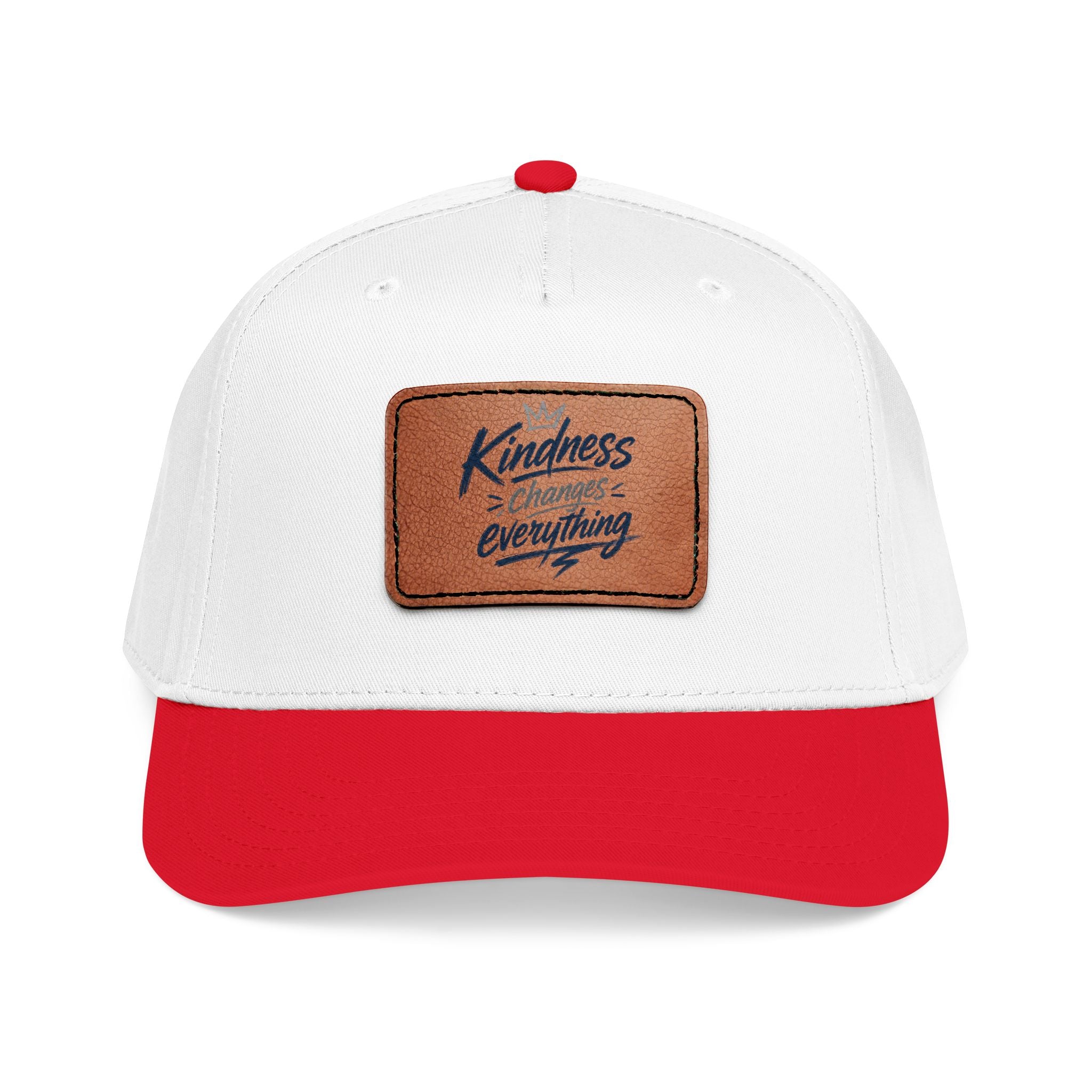 Vintage-inspired baseball cap featuring a brown leather patch with the phrase “Kindness Changes Everything” on a structured mid-profile snapback hat.