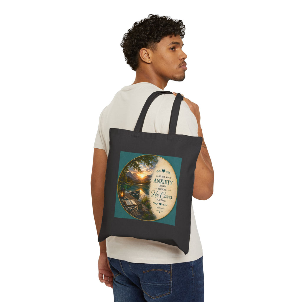 Christian cotton canvas tote bag featuring 1 Peter 5:7, “Cast All Your Anxiety on Him,” with peaceful nature-inspired artwork and reinforced shoulder straps for church, Bible study, shopping, and everyday use.