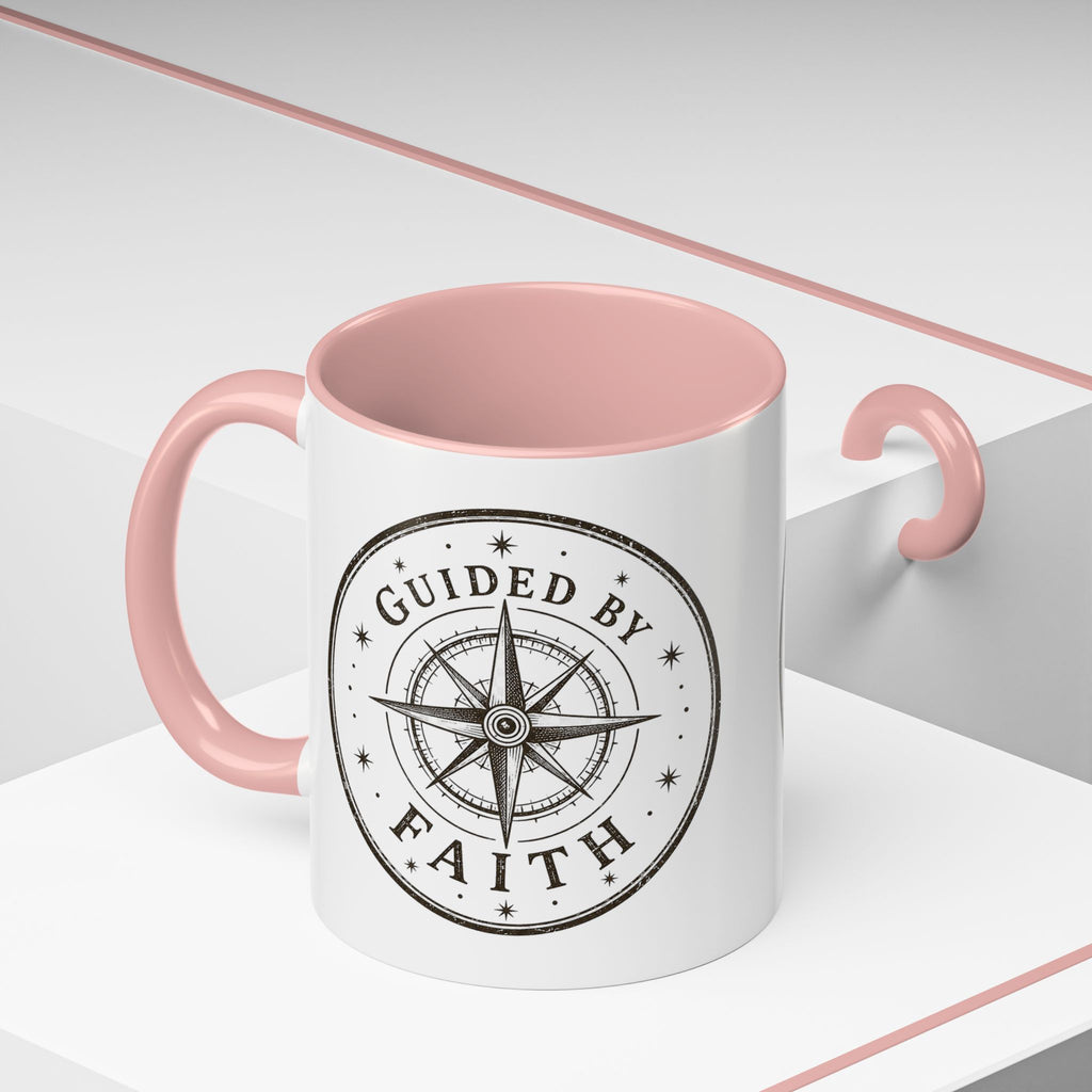 Inspirational ceramic accent coffee mug featuring a compass design and “Guided by Faith” message with colorful handle and interior accents on a glossy white mug.
