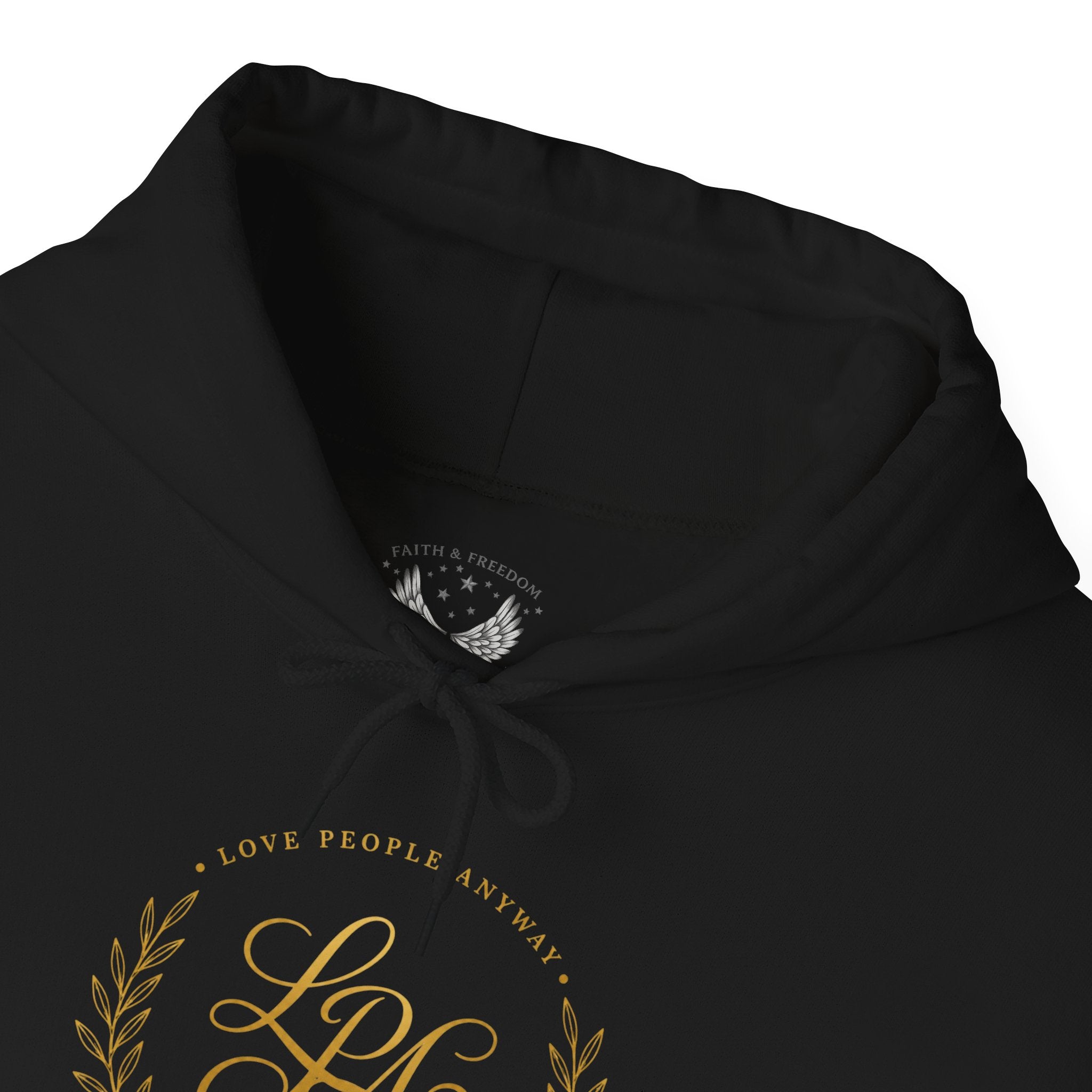 Inspirational Christian hoodie featuring elegant “Love People Anyway” script typography on a soft, cozy hooded sweatshirt designed to encourage kindness and compassion.