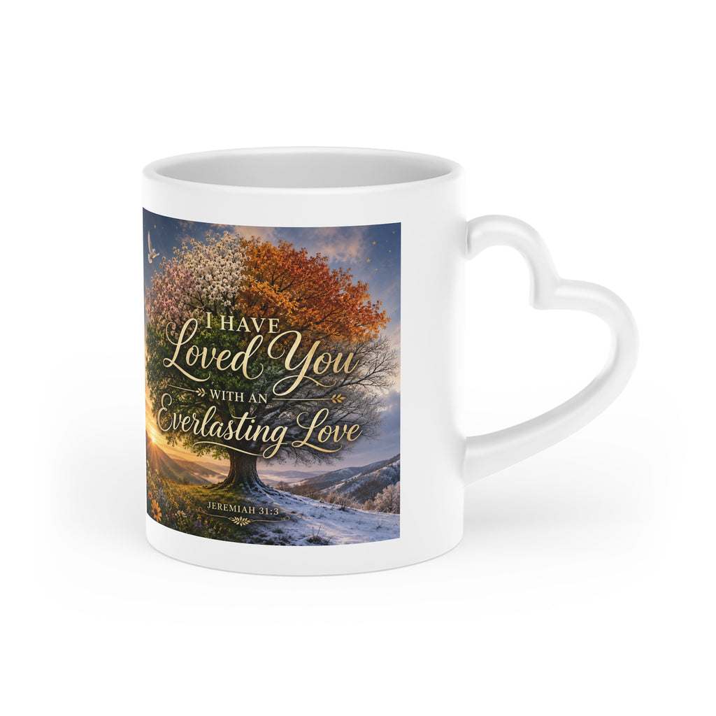 White ceramic heart-shaped handle mug featuring a panoramic four-season landscape with the Scripture "I Have Loved You with an Everlasting Love" from Jeremiah 31:3 in vibrant wraparound artwork.