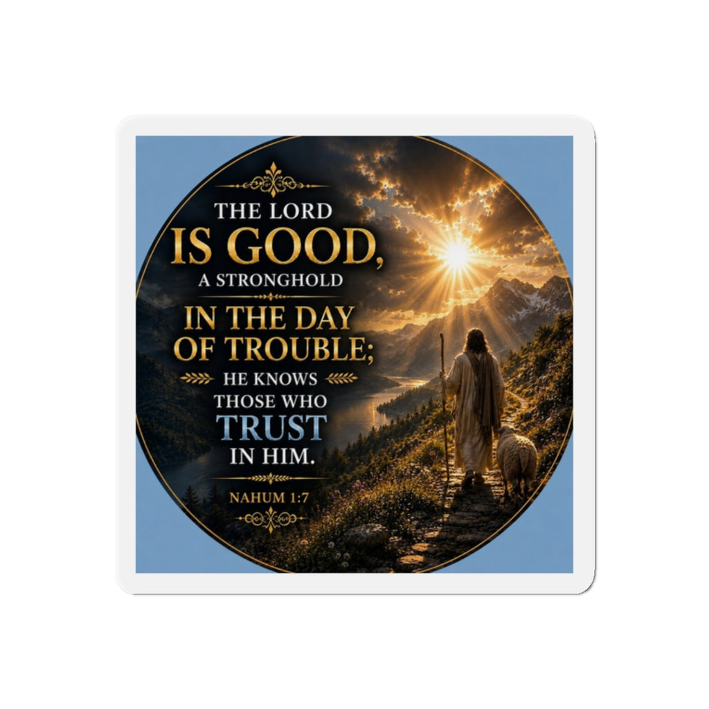 Christian die-cut magnet featuring Nahum 1:7, a shepherd walking with a sheep along a mountain path at sunrise, with golden rays of light and inspirational scripture about trusting in God.