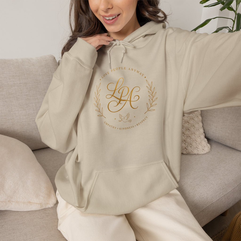 Inspirational Christian hoodie featuring elegant “Love People Anyway” script typography on a soft, cozy hooded sweatshirt designed to encourage kindness and compassion.