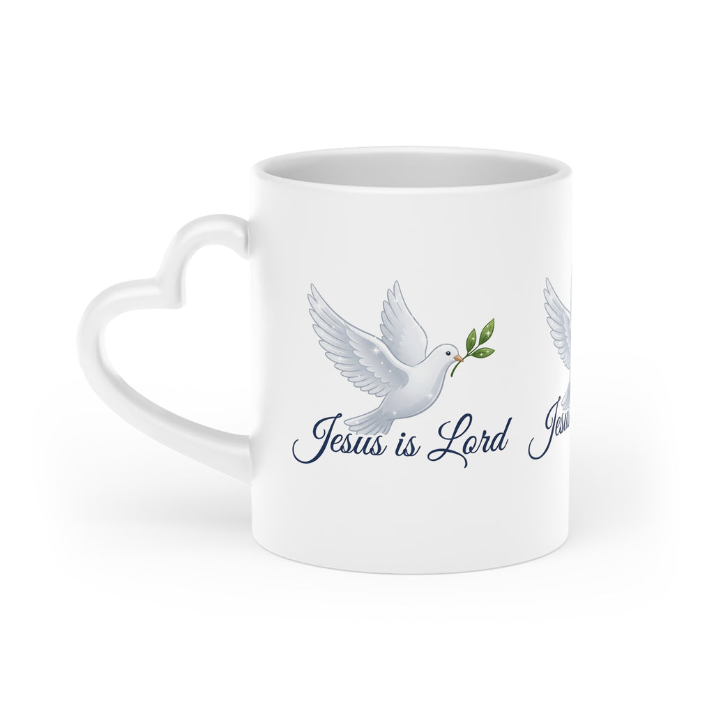 White ceramic heart-shaped handle mug featuring a white dove carrying an olive branch with the words "Jesus Is Lord" in elegant script on a glossy finish.