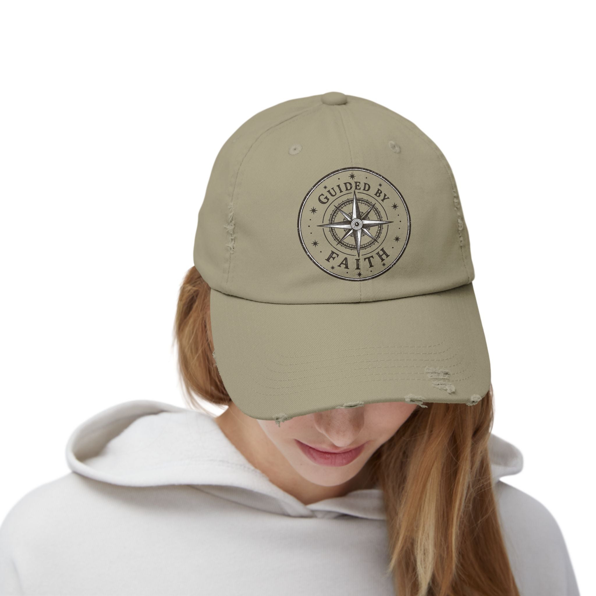Vintage distressed Christian baseball cap featuring a compass emblem and the phrase “Guided by Faith” on a soft low-profile cotton twill hat.