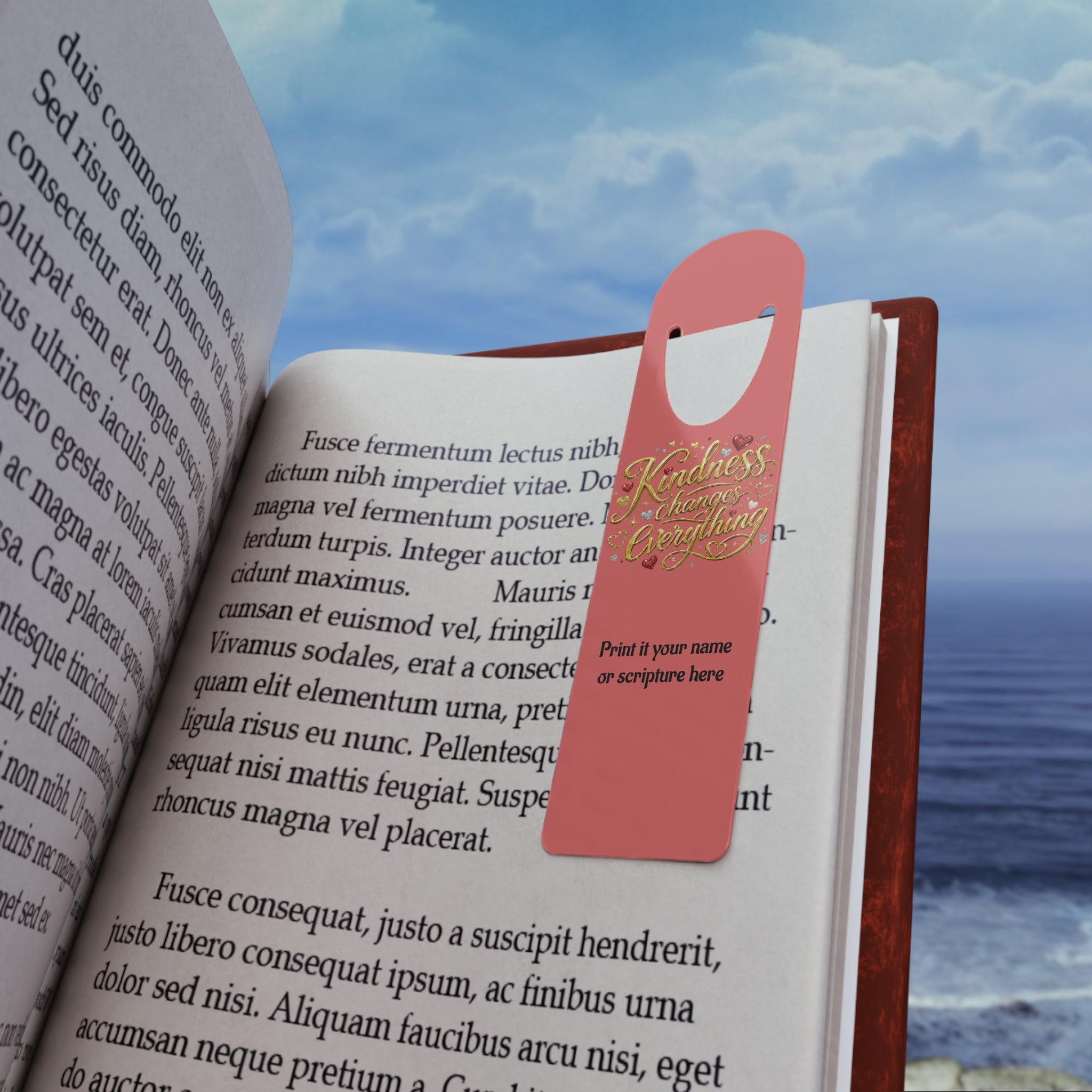 Inspirational aluminum bookmark featuring the message “Kindness Changes Everything” on a coral background with optional personalized name or scripture, brushed metal backing, and secure page-holding slot.