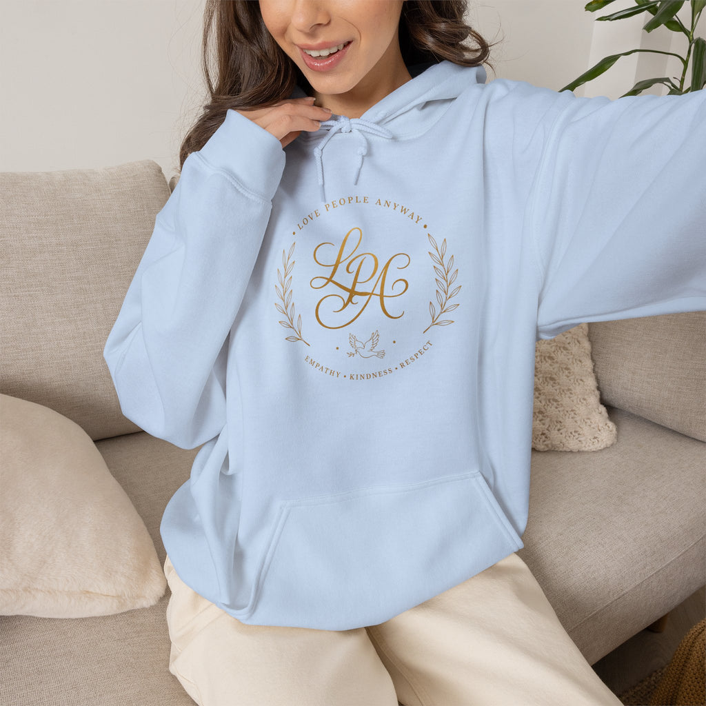 Inspirational Christian hoodie featuring elegant “Love People Anyway” script typography on a soft, cozy hooded sweatshirt designed to encourage kindness and compassion.