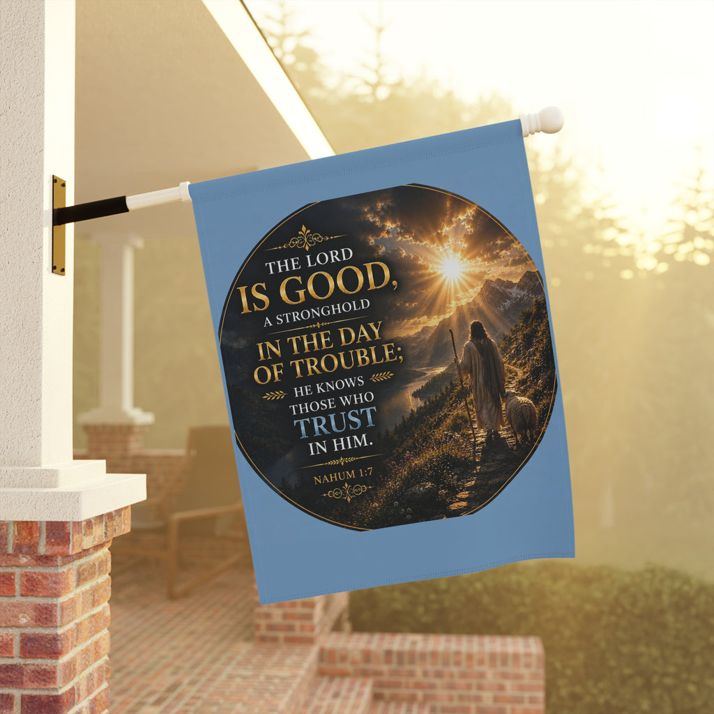 Inspirational Christian garden flag featuring a sunrise pathway scene with a lone figure walking toward golden light and “The Lord Is Good” scripture artwork.