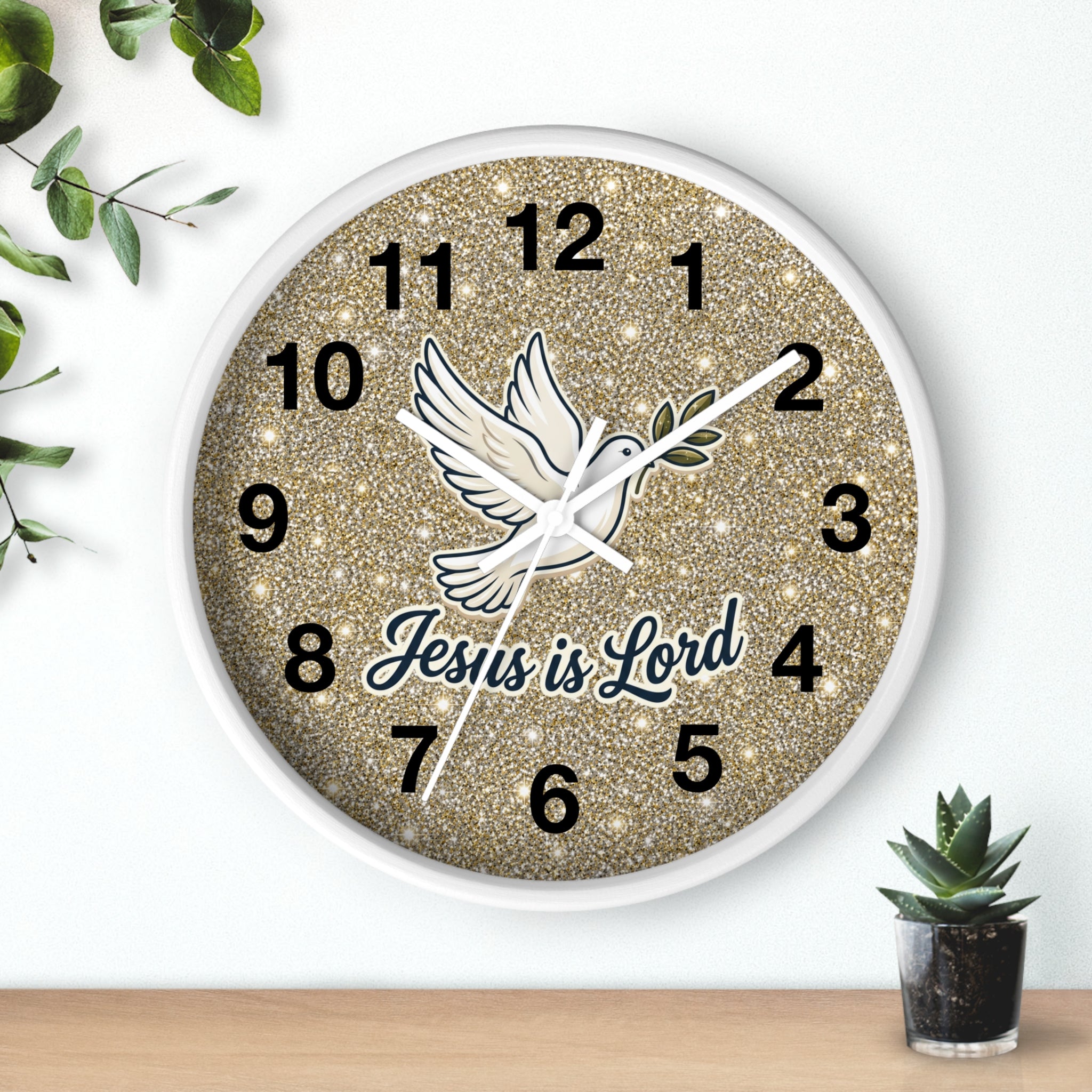 Round Christian wall clock featuring a white dove carrying an olive branch above the words "Jesus Is Lord" on a warm gold shimmer background with a wood frame and silent quartz movement.