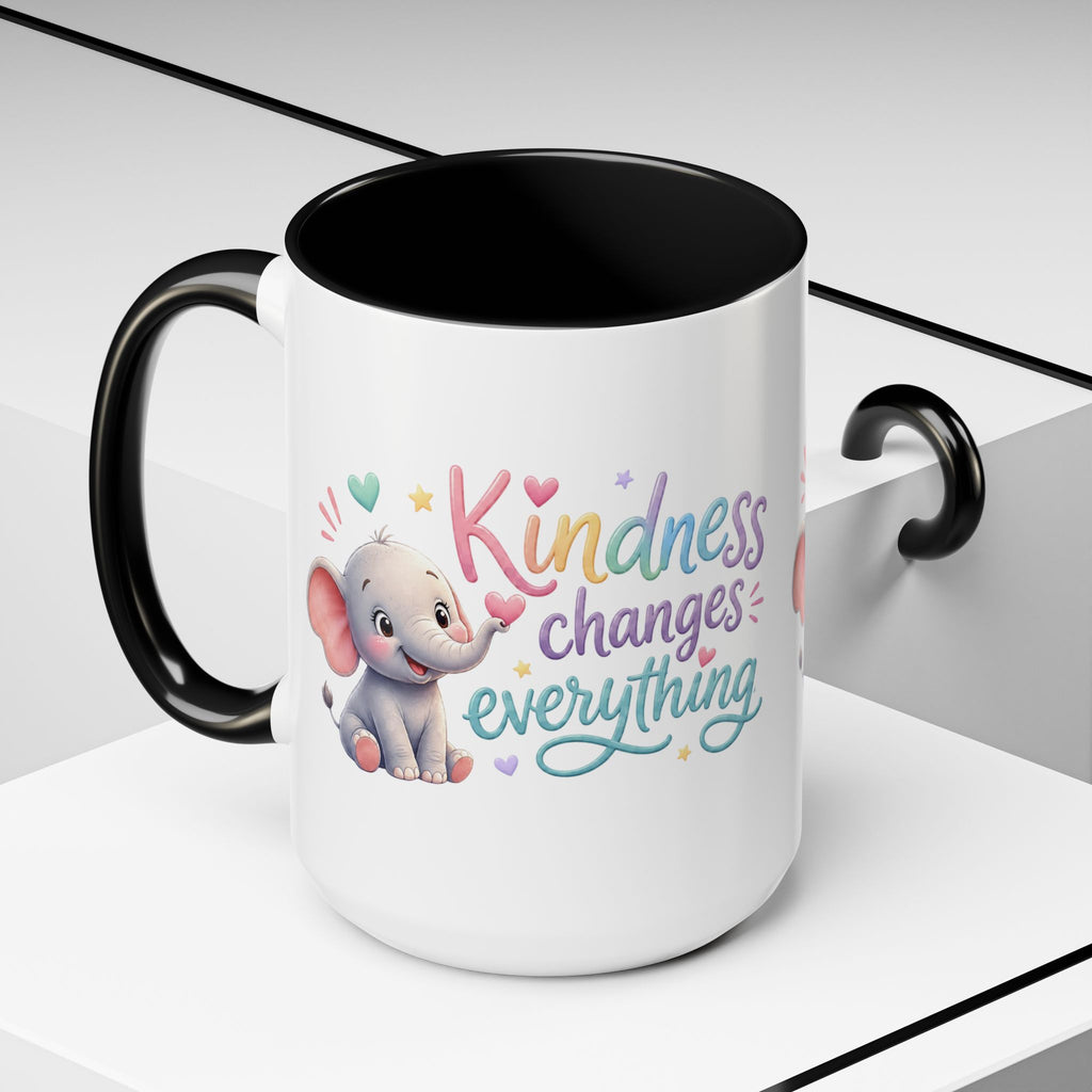 Cute ceramic coffee mug featuring a pastel baby elephant and the uplifting message “Kindness Changes Everything” with colorful accent handle and interior.