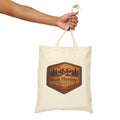 Rustic Christian cotton canvas tote bag featuring Micah 6:8 and the message “Walk Humbly,” with vintage mountain landscape artwork, pine trees, birds, and a winding trail in a leather-patch style design.
