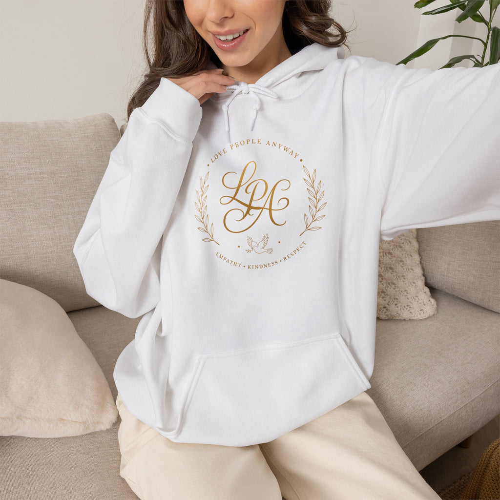 Inspirational Christian hoodie featuring elegant “Love People Anyway” script typography on a soft, cozy hooded sweatshirt designed to encourage kindness and compassion.