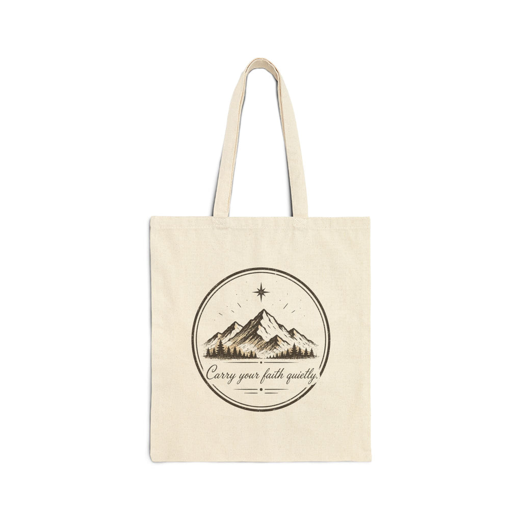 Rustic cotton canvas tote bag featuring mountain peaks, pine trees, a guiding star, and the Faith & Freedom Creations tagline “Carry Your Faith Quietly” in a vintage outdoor-inspired design.