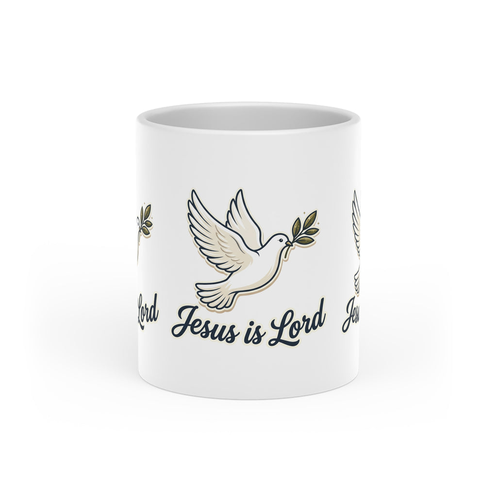 White ceramic heart-shaped handle mug featuring repeating white doves carrying olive branches with the words "Jesus Is Lord" in elegant script.