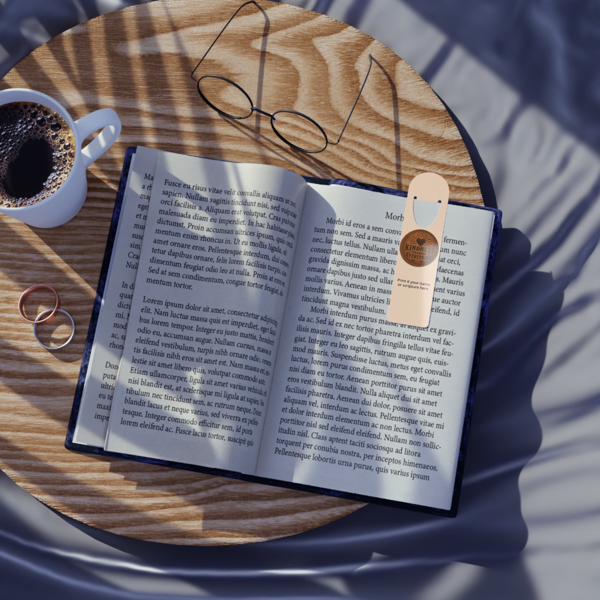 Personalized aluminum bookmark featuring a leather token design and the phrase “Kindness Changes Everything,” with custom name option, brushed metal backing, and secure page-holding slot.