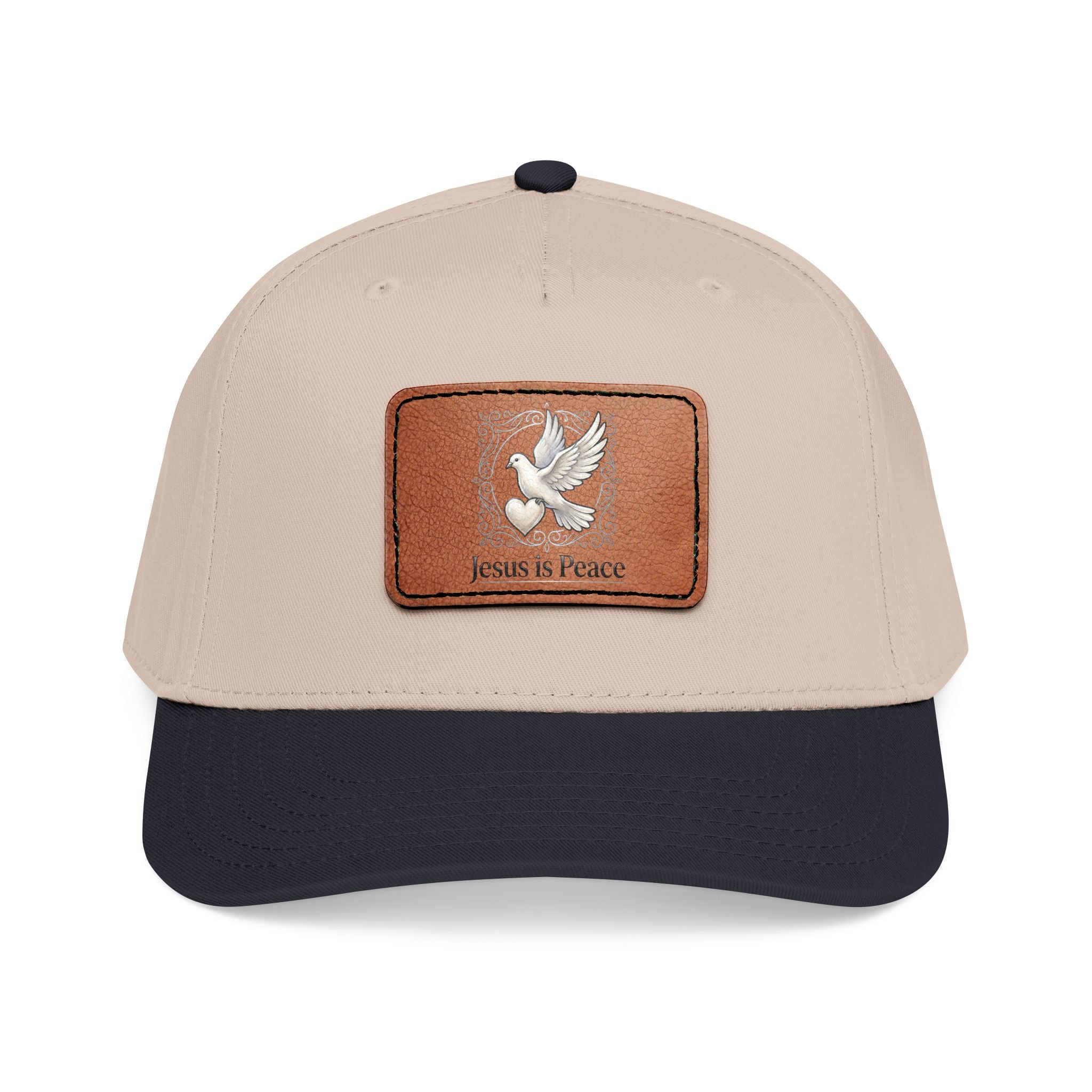 Beige and black Christian baseball cap featuring a brown leather patch with a white dove carrying a heart and the words "Jesus Is Peace."