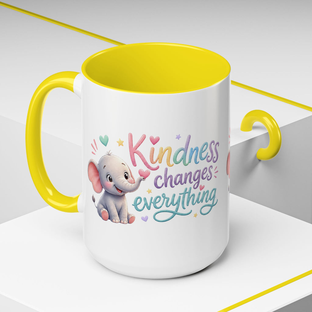 Cute ceramic coffee mug featuring a pastel baby elephant and the uplifting message “Kindness Changes Everything” with colorful accent handle and interior.