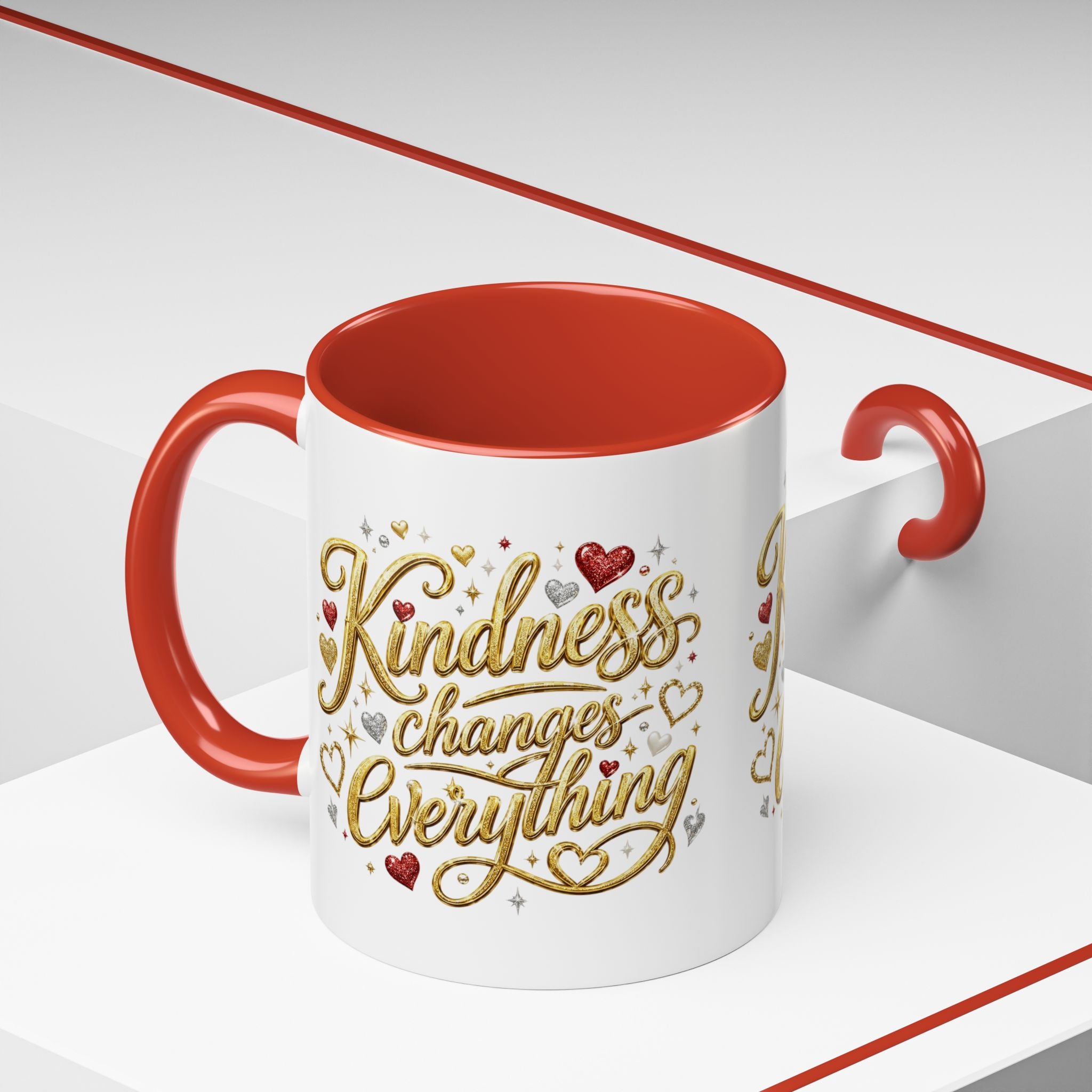Inspirational ceramic coffee mug featuring the hand-lettered message “Kindness Changes Everything” with gold flourishes, hearts, and colorful accent handle and interior.