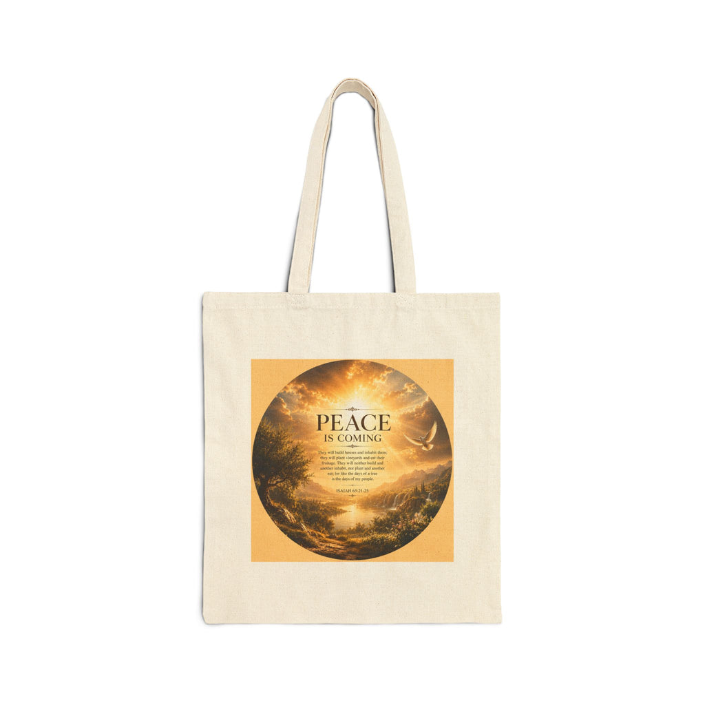 Christian cotton canvas tote bag featuring Isaiah 65:21-25 and the message “Peace Is Coming,” with golden paradise landscape artwork, waterfalls, mountains, river, white dove, and radiant sunlight.