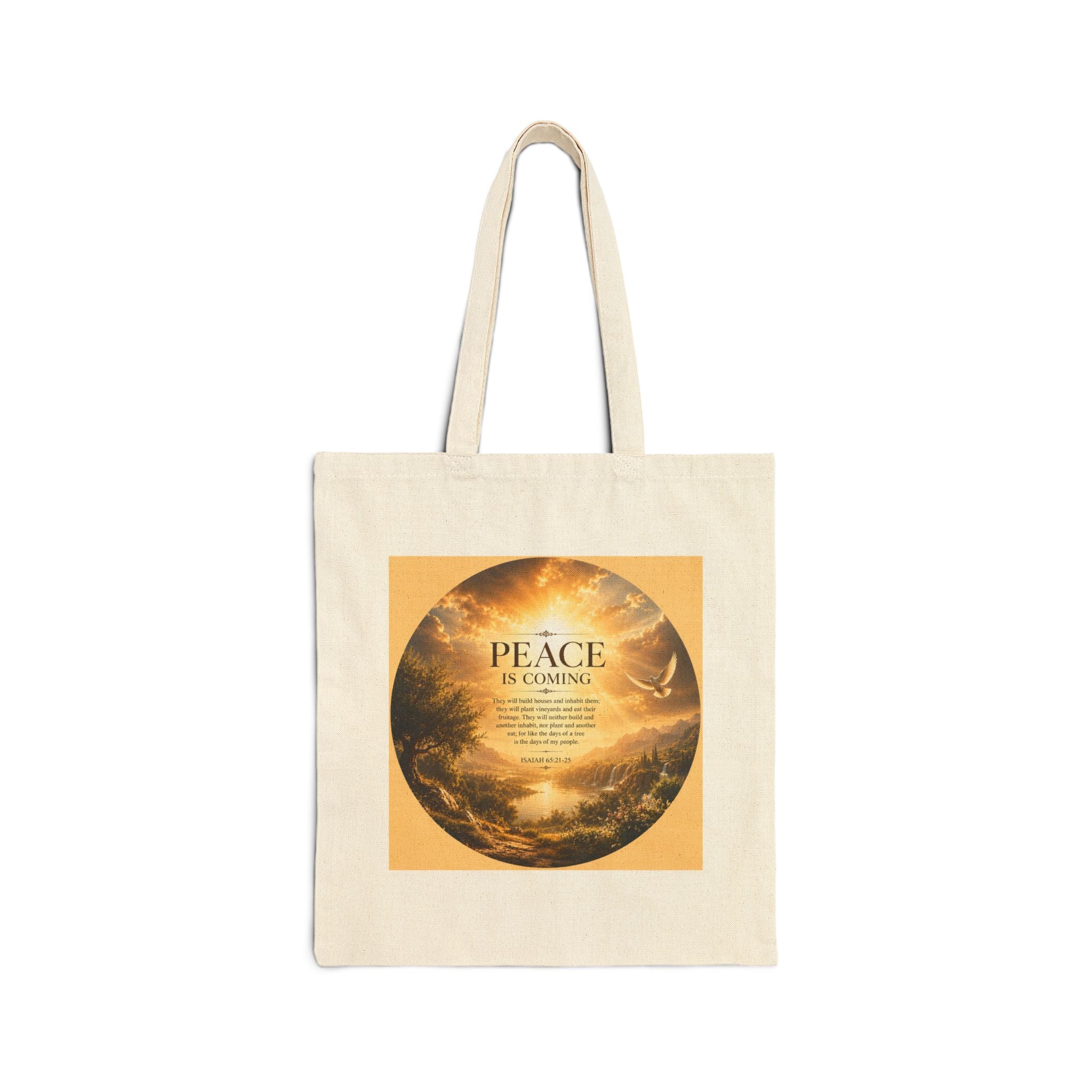 Christian cotton canvas tote bag featuring Isaiah 65:21-25 and the message “Peace Is Coming,” with golden paradise landscape artwork, waterfalls, mountains, river, white dove, and radiant sunlight.